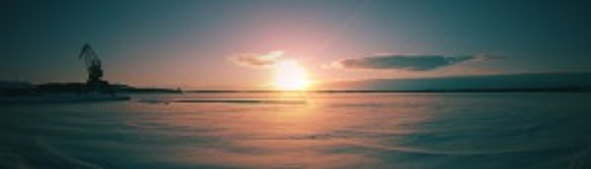 Landscape image with the frozen sea and a sunset.