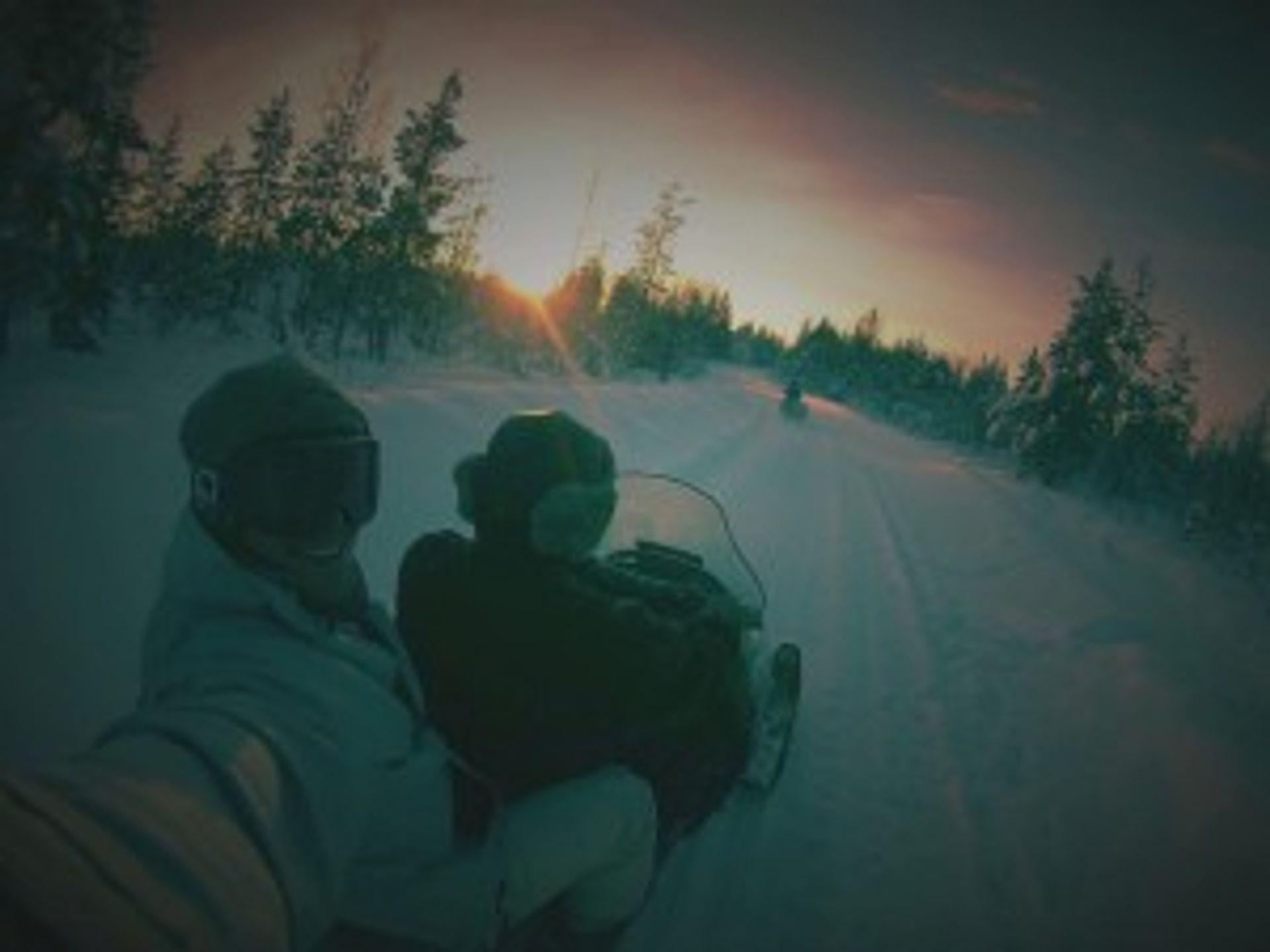 A picture of our ambassador Jesus and his friend skiing snow jets in the dark.