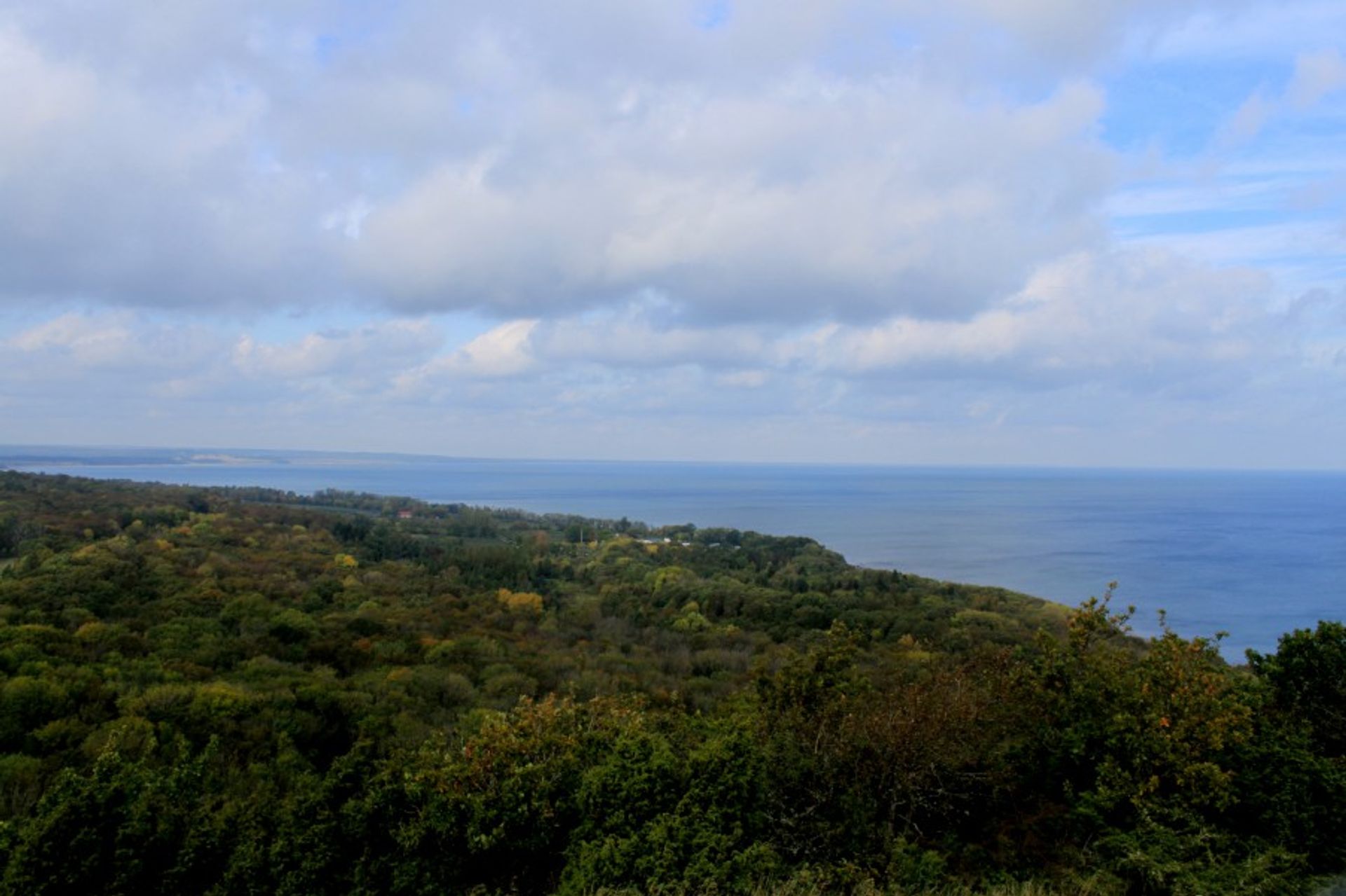 At the top of the view from Stenshuvud where the blue lake is seen.