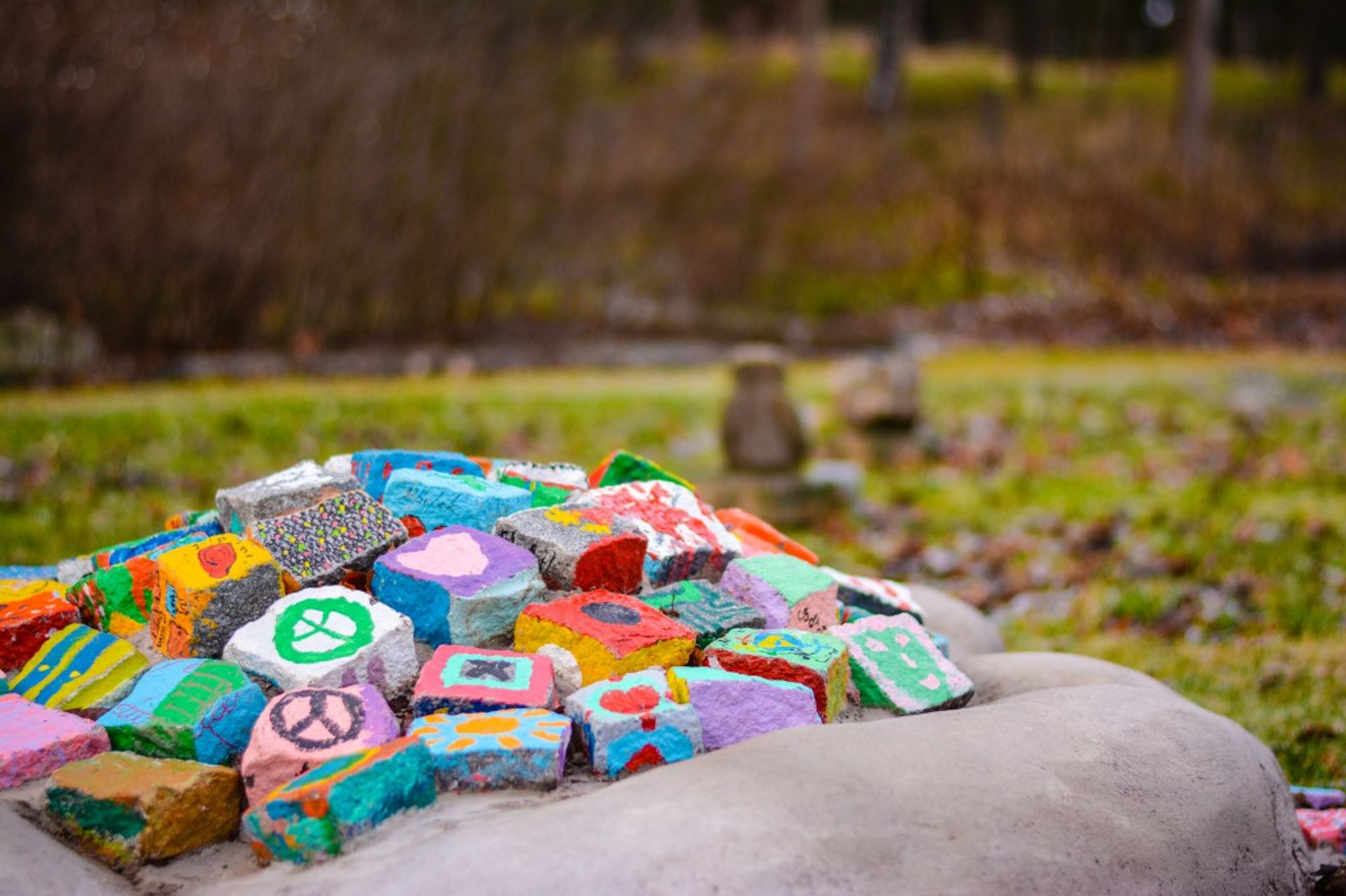 This palm shaped rock contains hand-painted peace signs. A prayer for peace, perhaps?