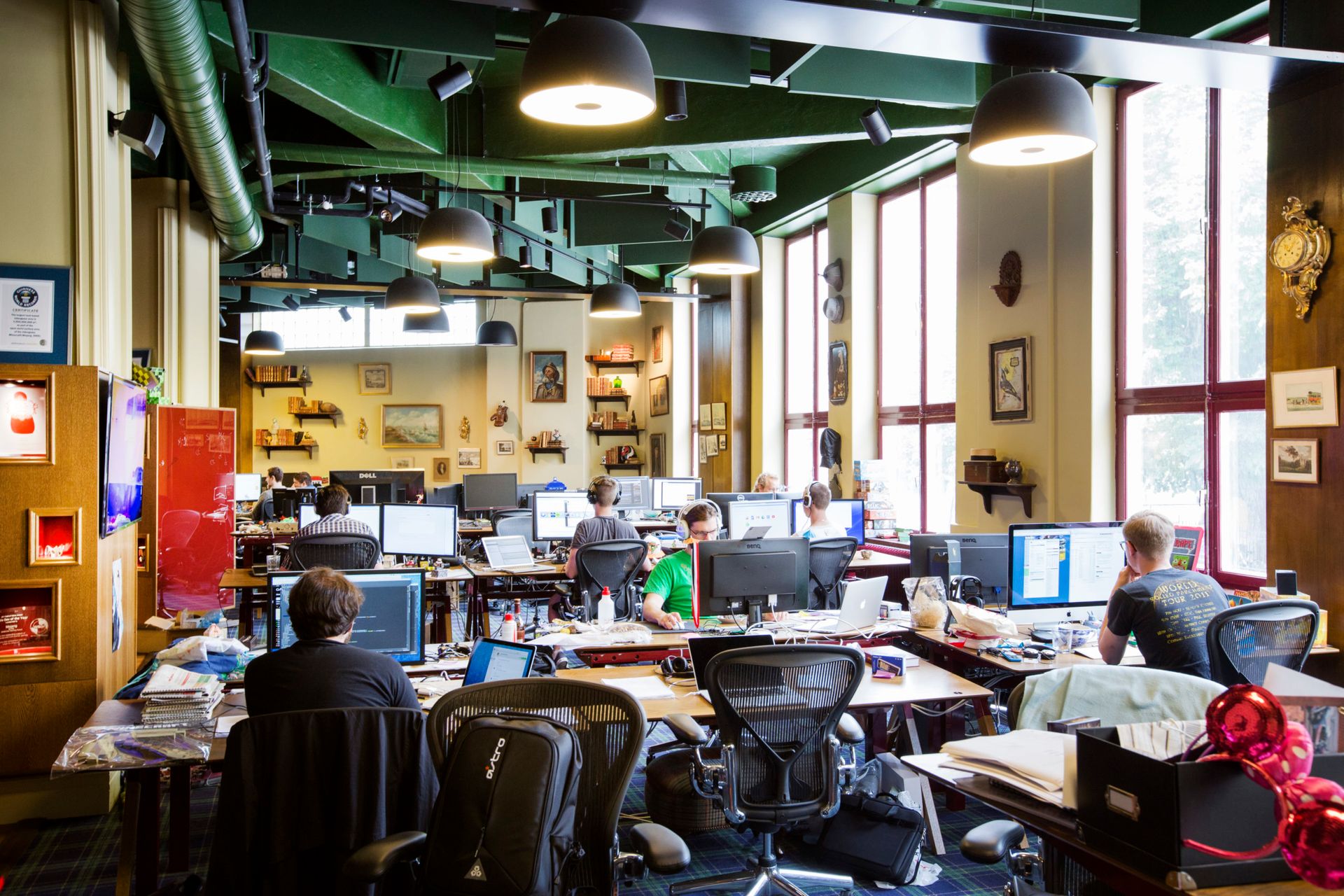 People working at computers in an office.