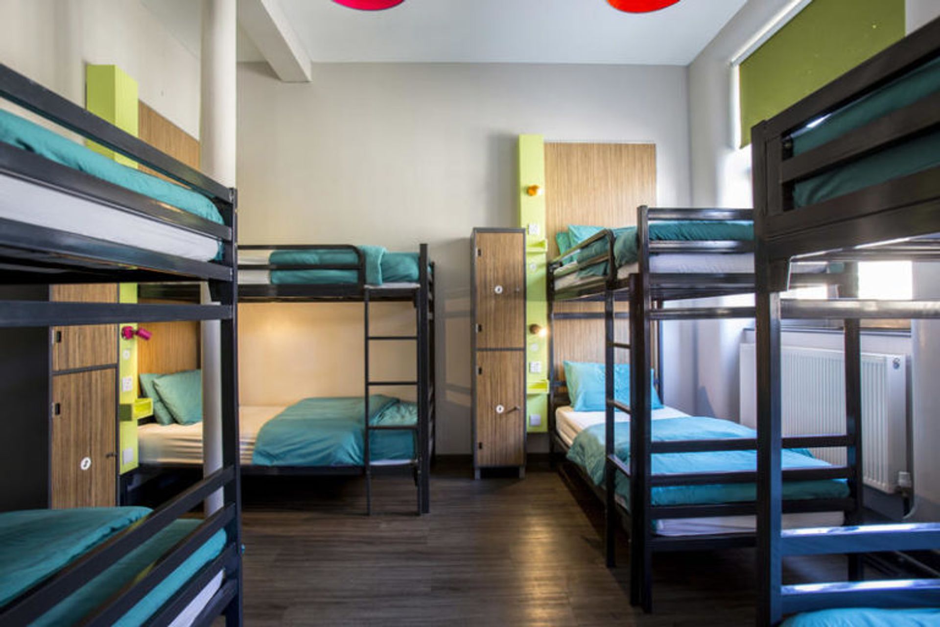 Rows of bunk beds in a student hostel room.