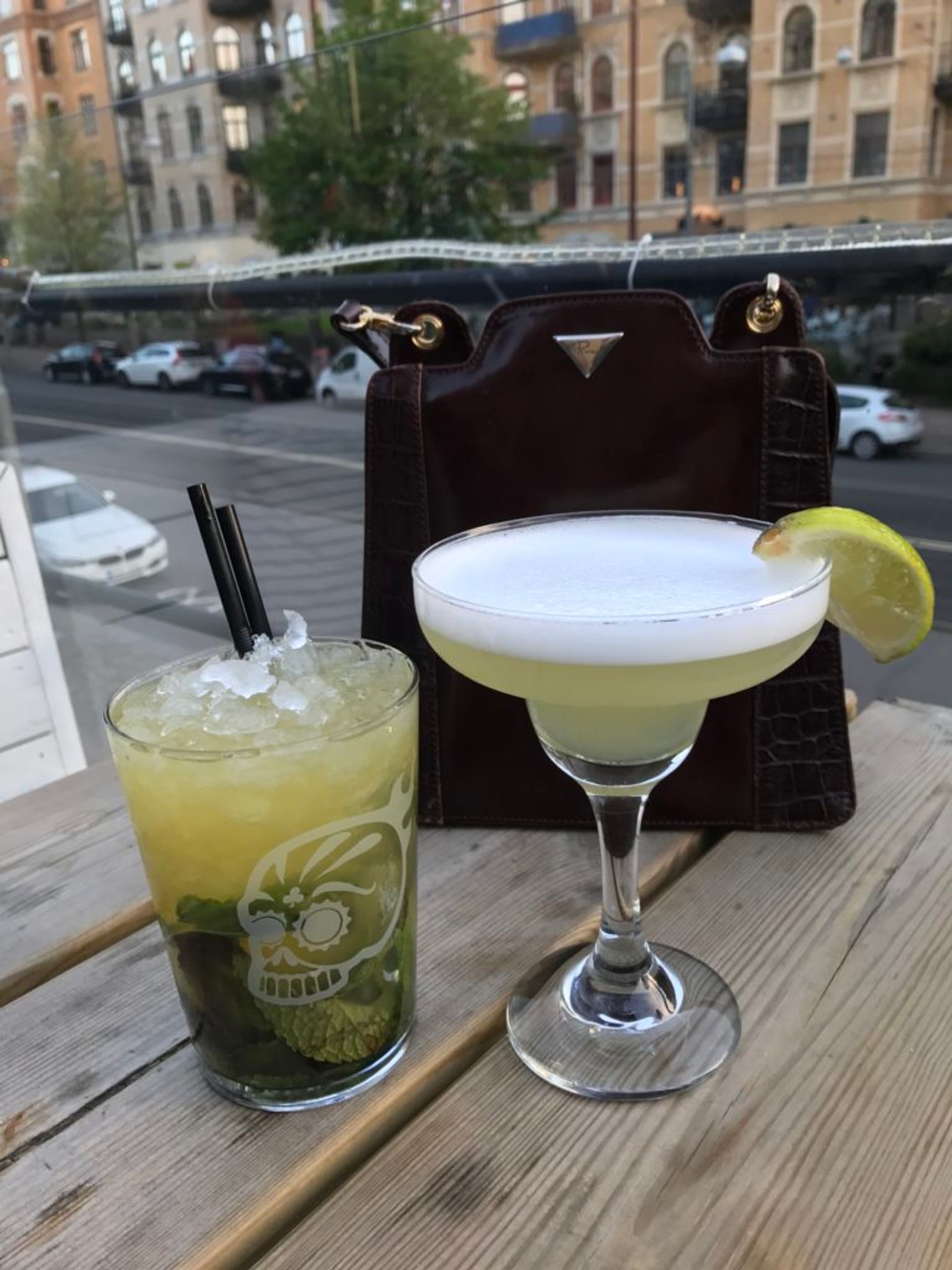 Two cocktail drinks on a table.