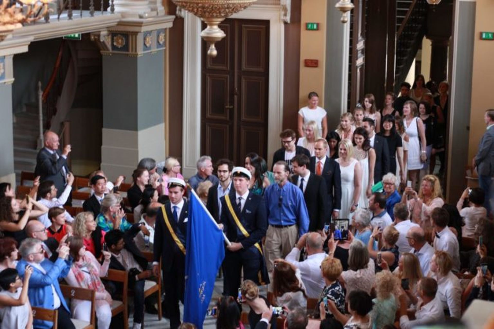 Students at a graduation ceremony.