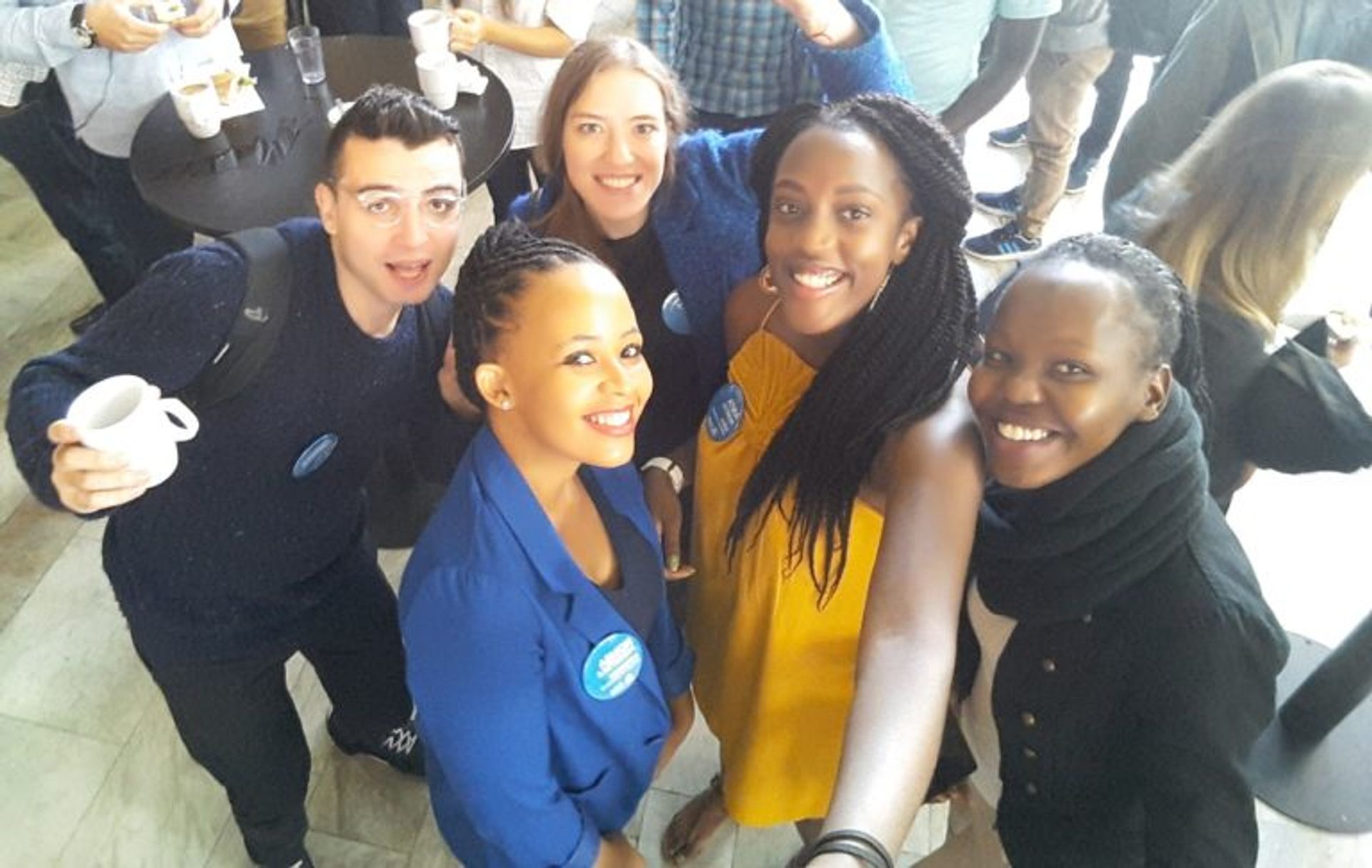 Anita takes a selfie with a group of scholarship holders at a event in Stockholm. 