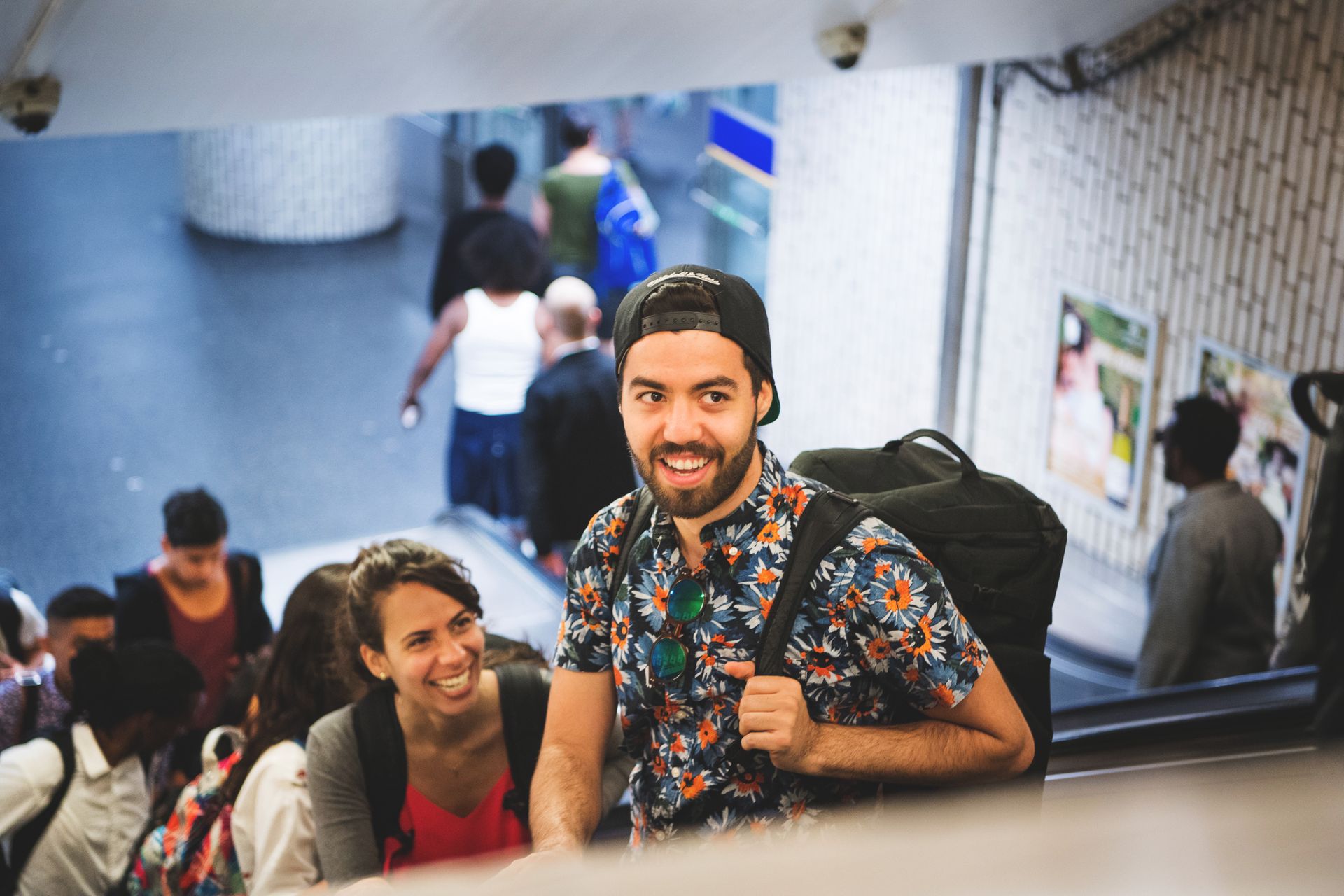 Students standing on an escalator.