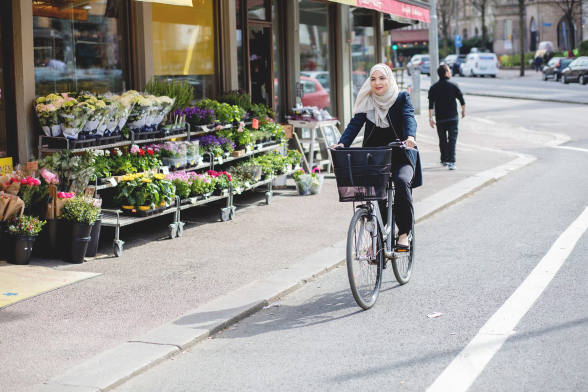 Person cycling in a bicycle lane.