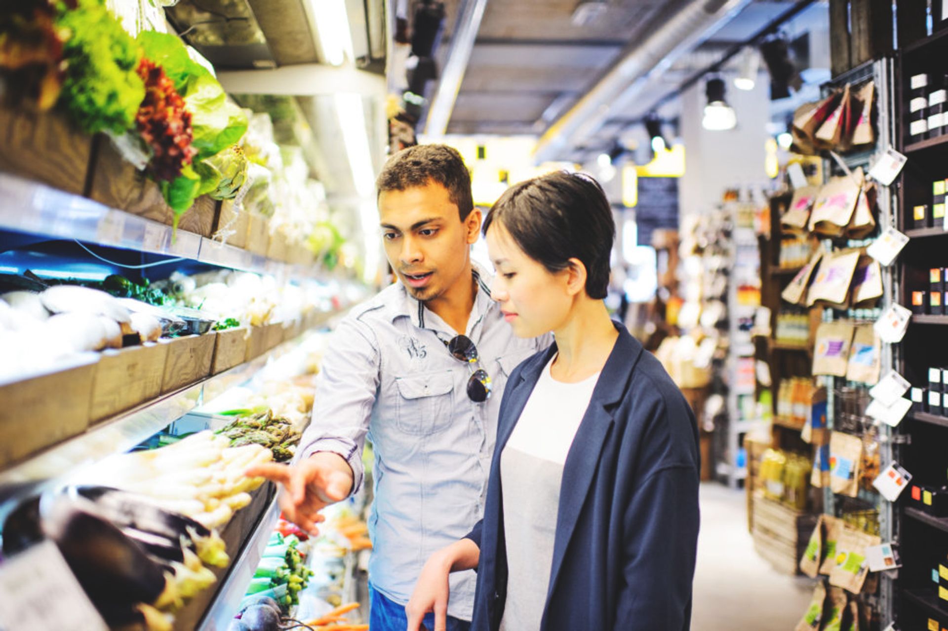 Students food shopping in a supermarket.