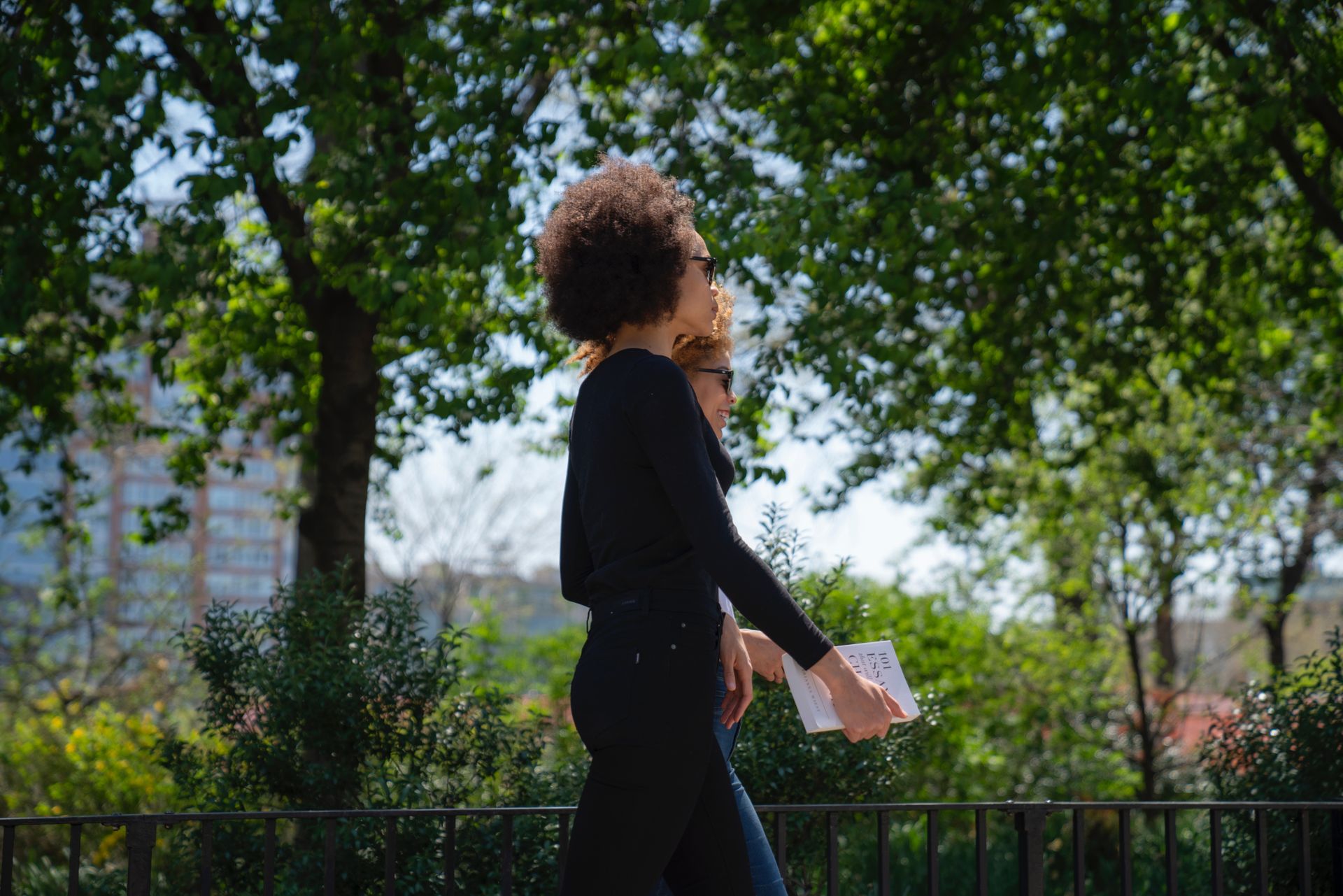 Two people walking outside.