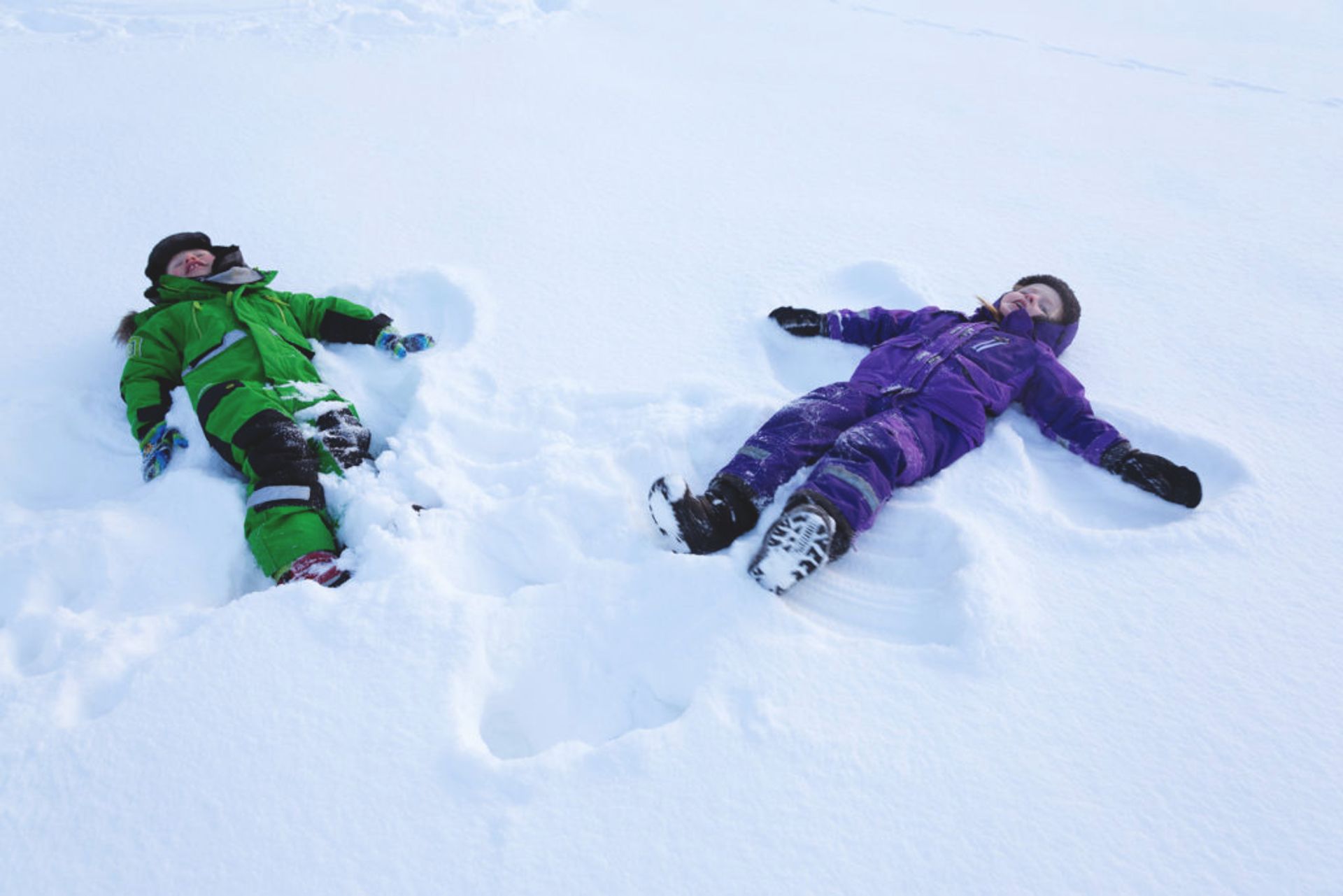 Children making snow angels.