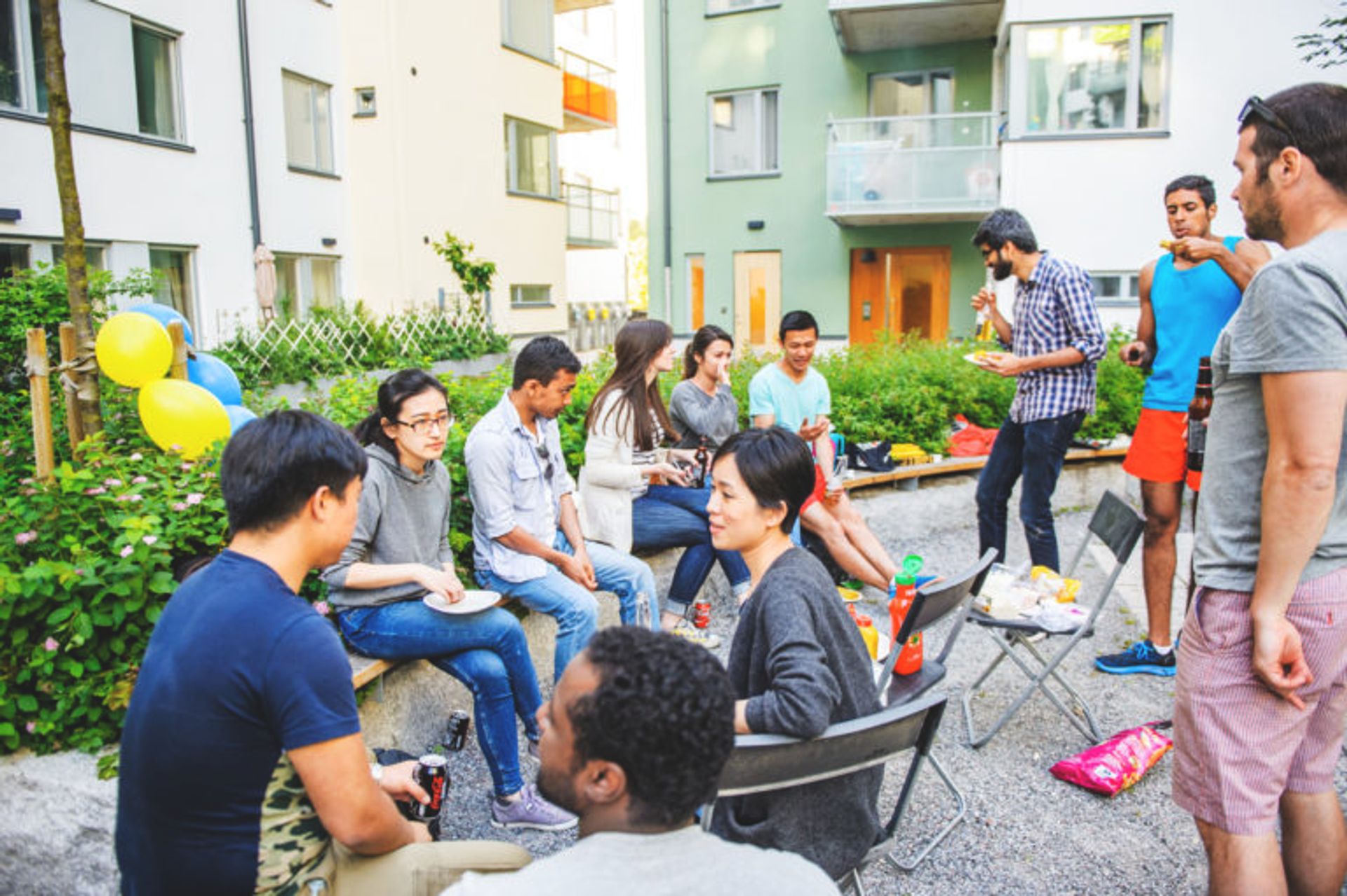 Students eating outside their student accomodation.