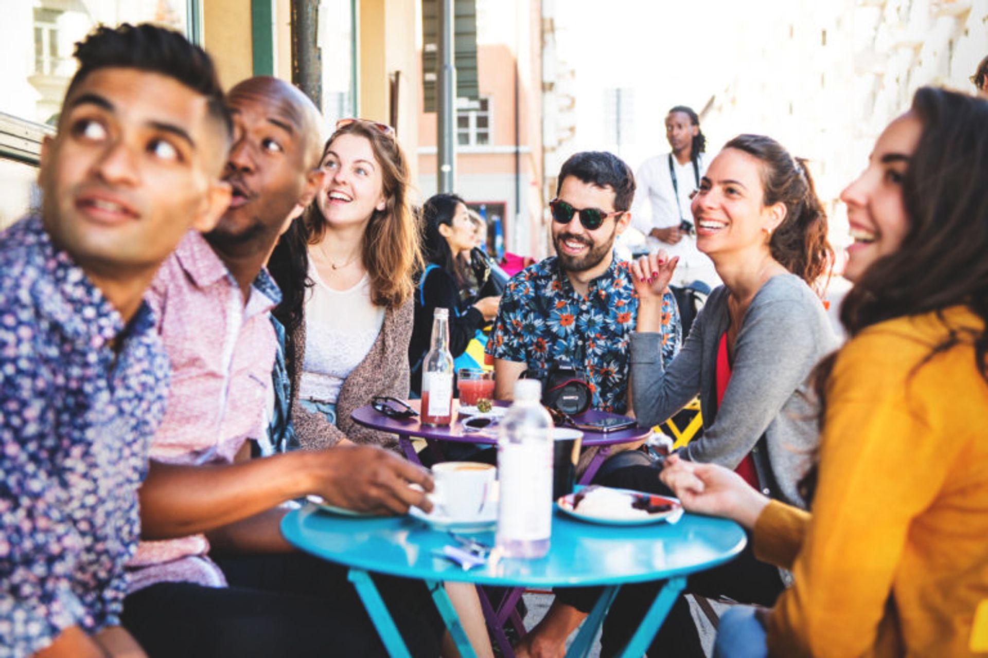 Students having fika at an outdoors cafe.