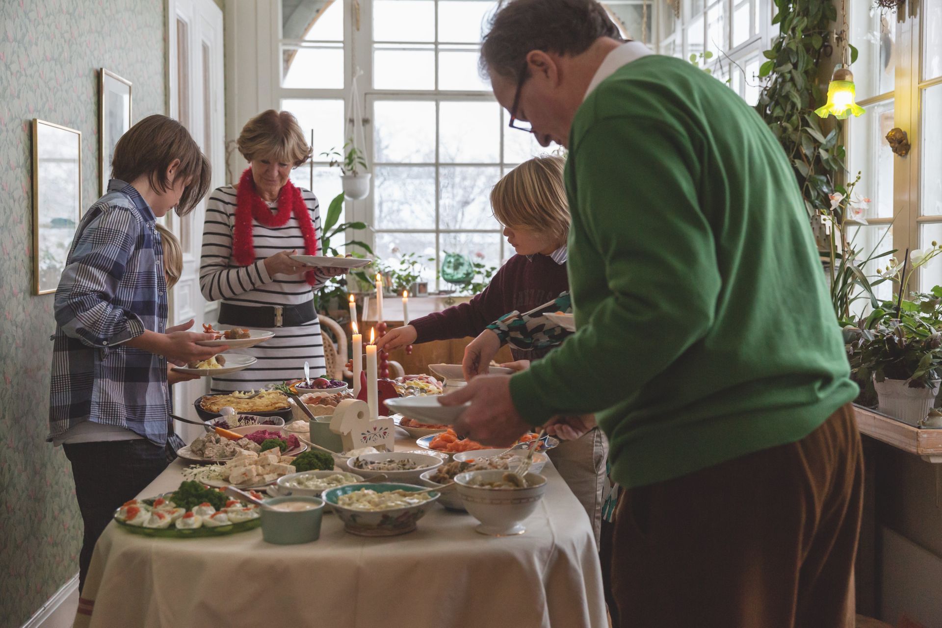 A family having a Swedish Christmas dinner.