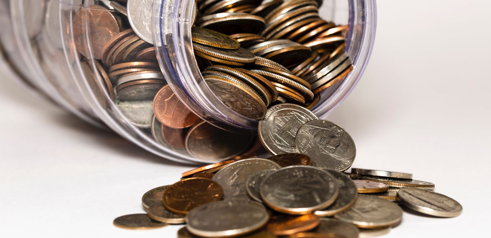 Coins spilling from a jar