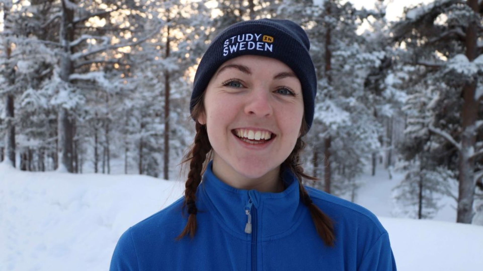 Photo of the author (me, Emma), in the snow smiling