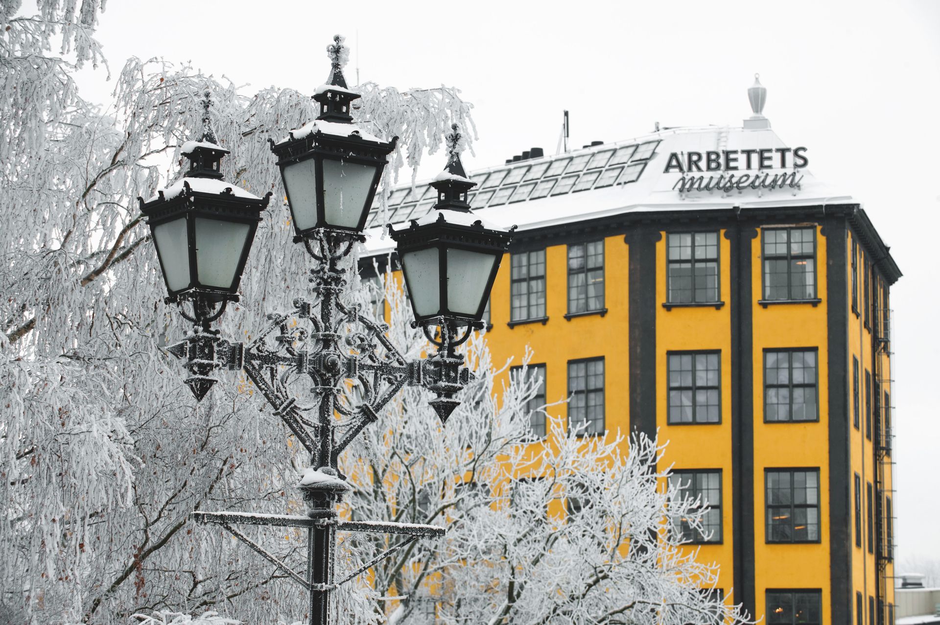 Yellow building in a snowy city.