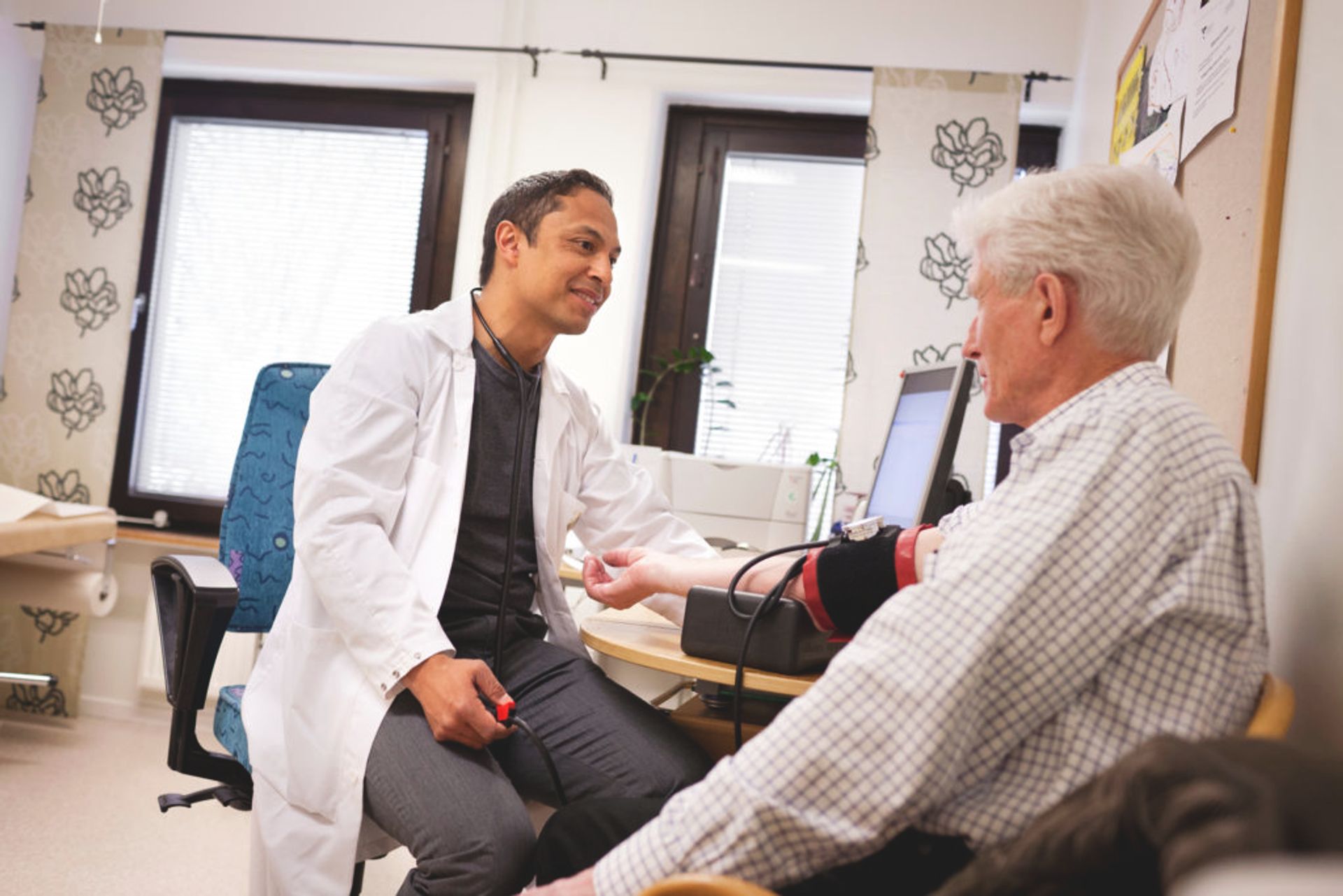 A person sits in a doctor's office having a check-up.