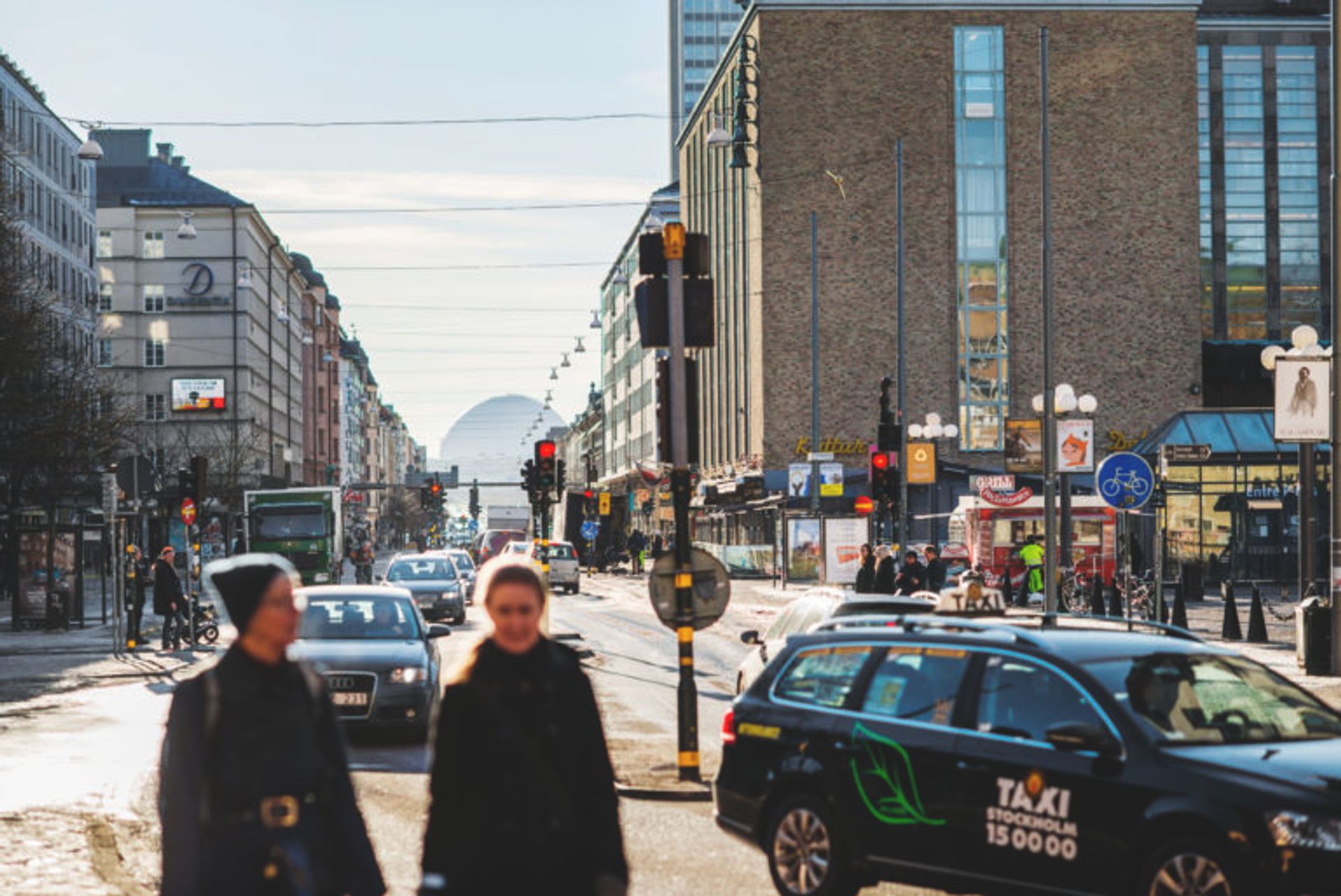 People walking down a street.