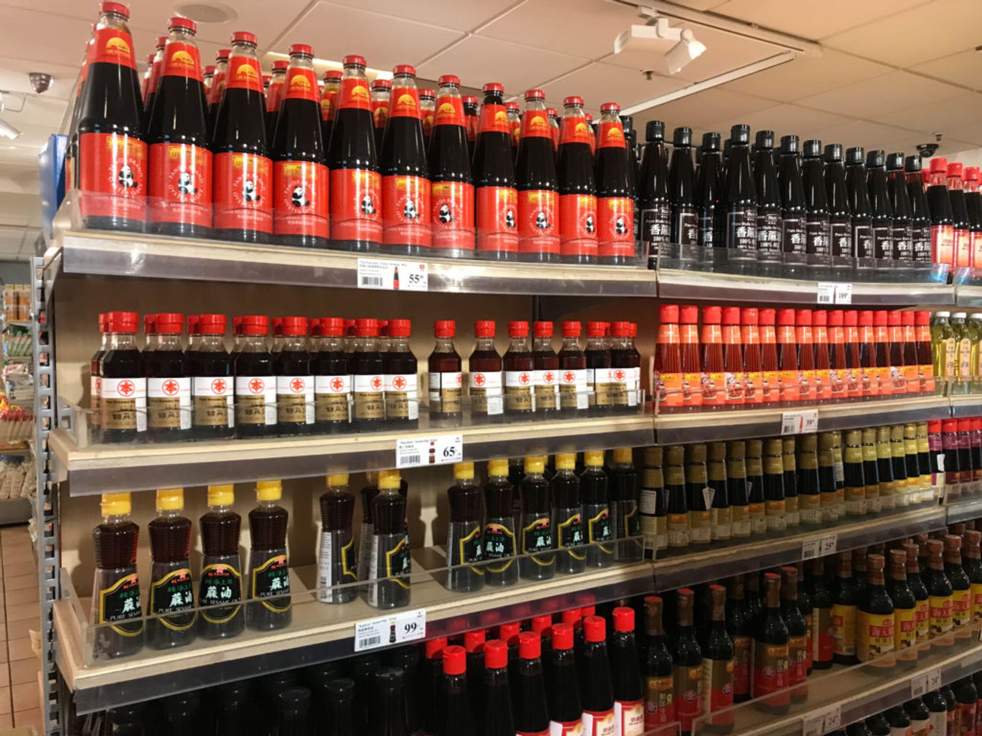 Shelves of sauce bottles.