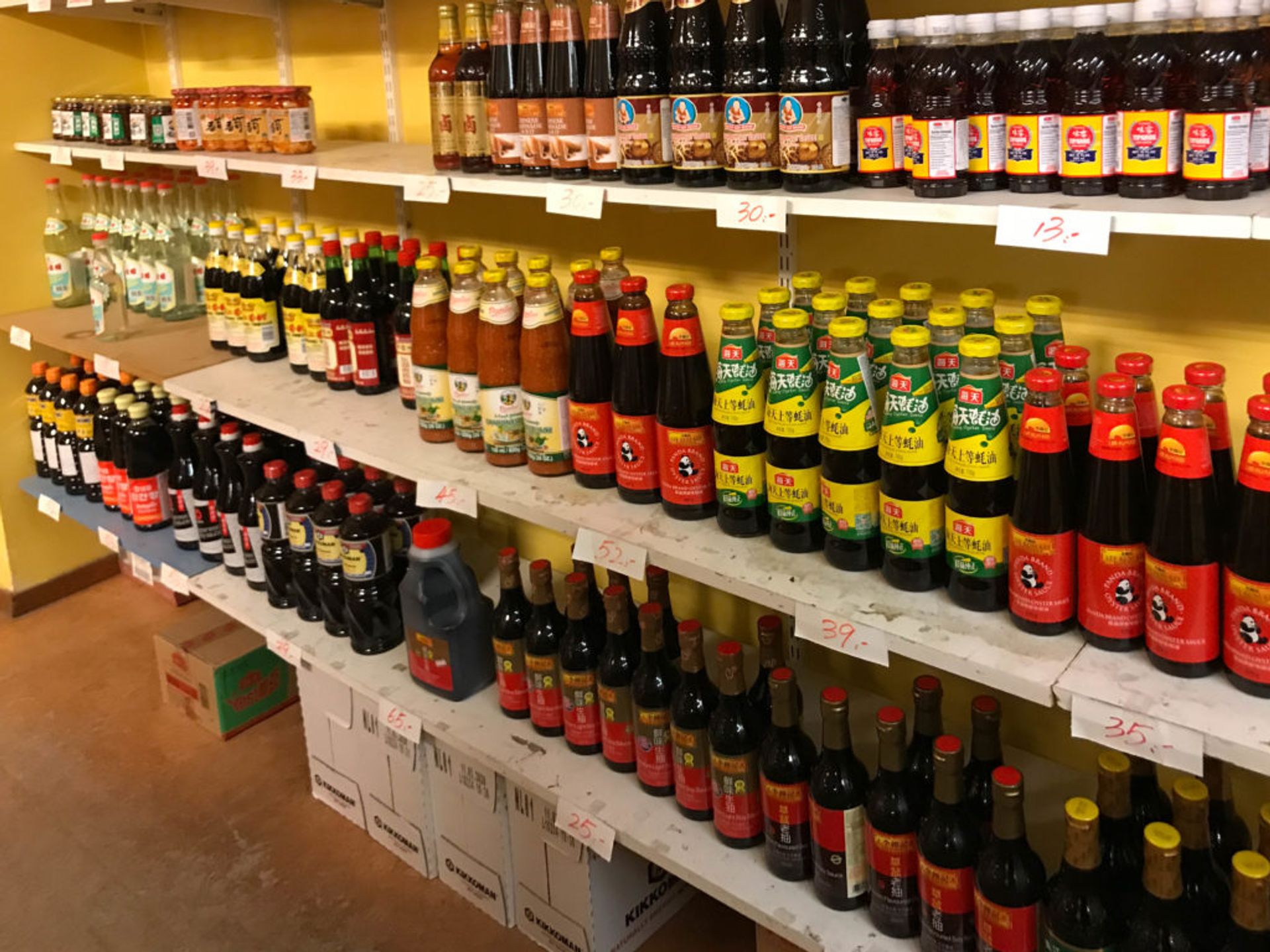 Shelves of sauce bottles.