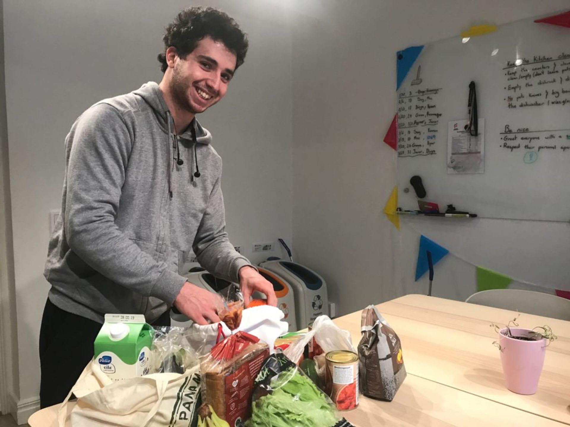 a smart student unpacks his groceries