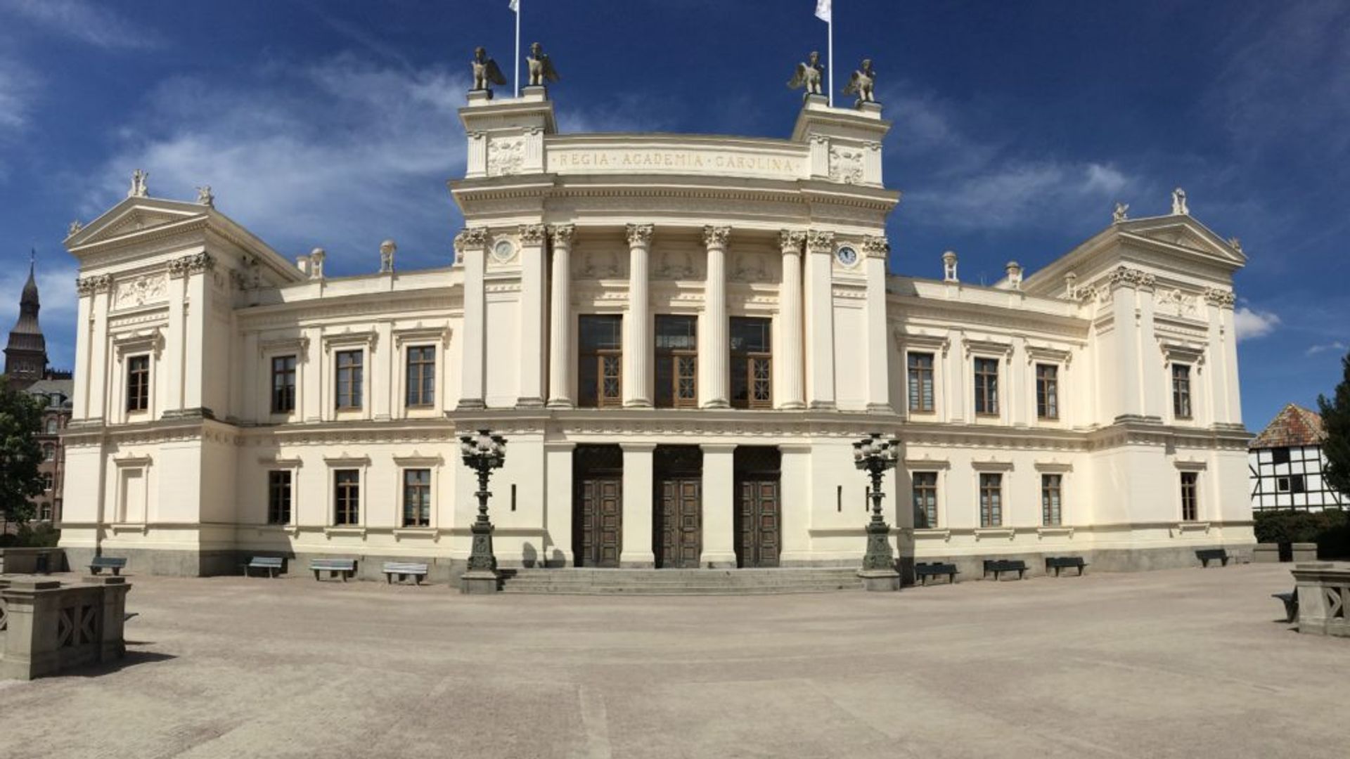 A large, white university building.