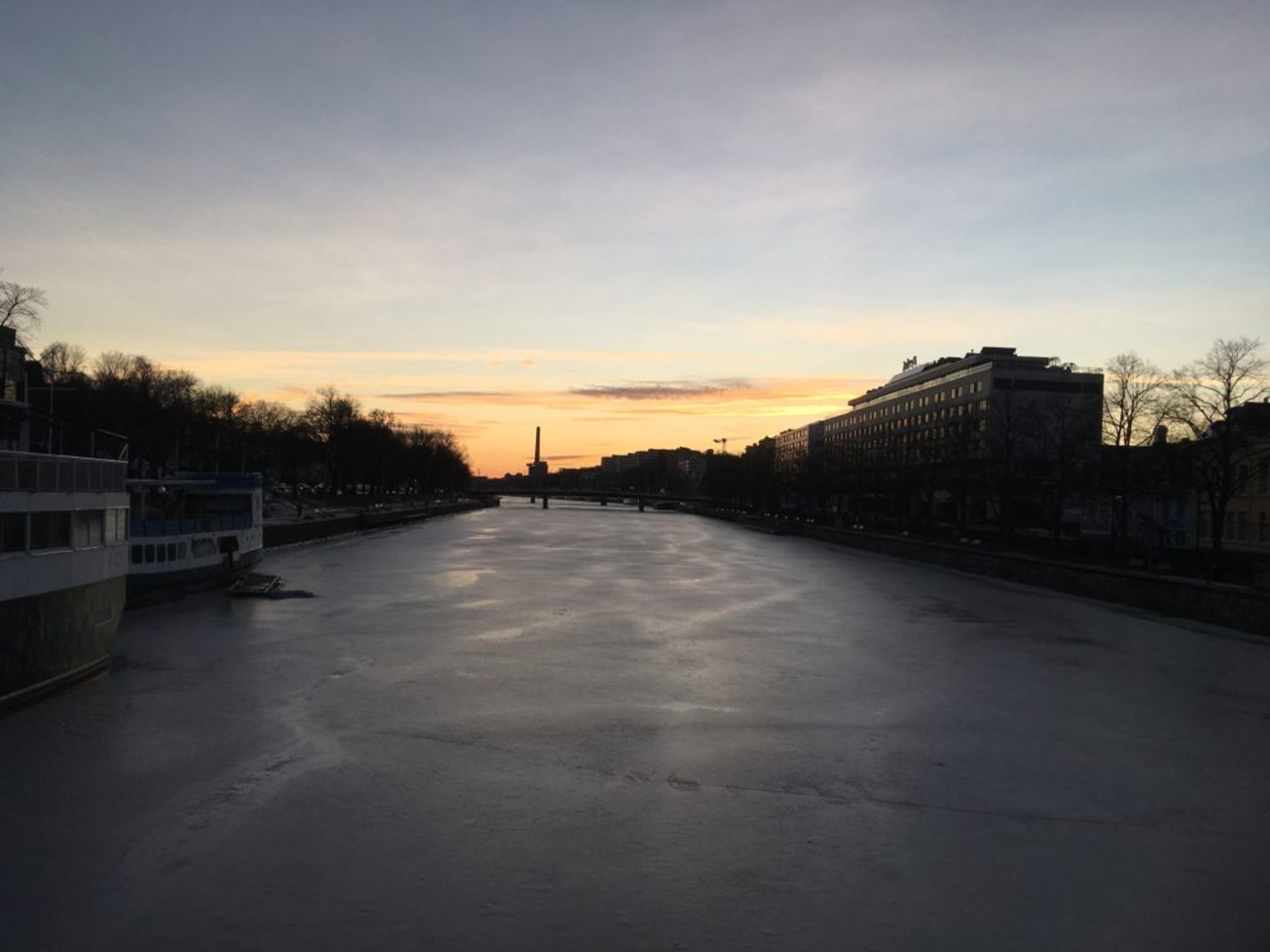 Sunset over the frozen river in Turku.