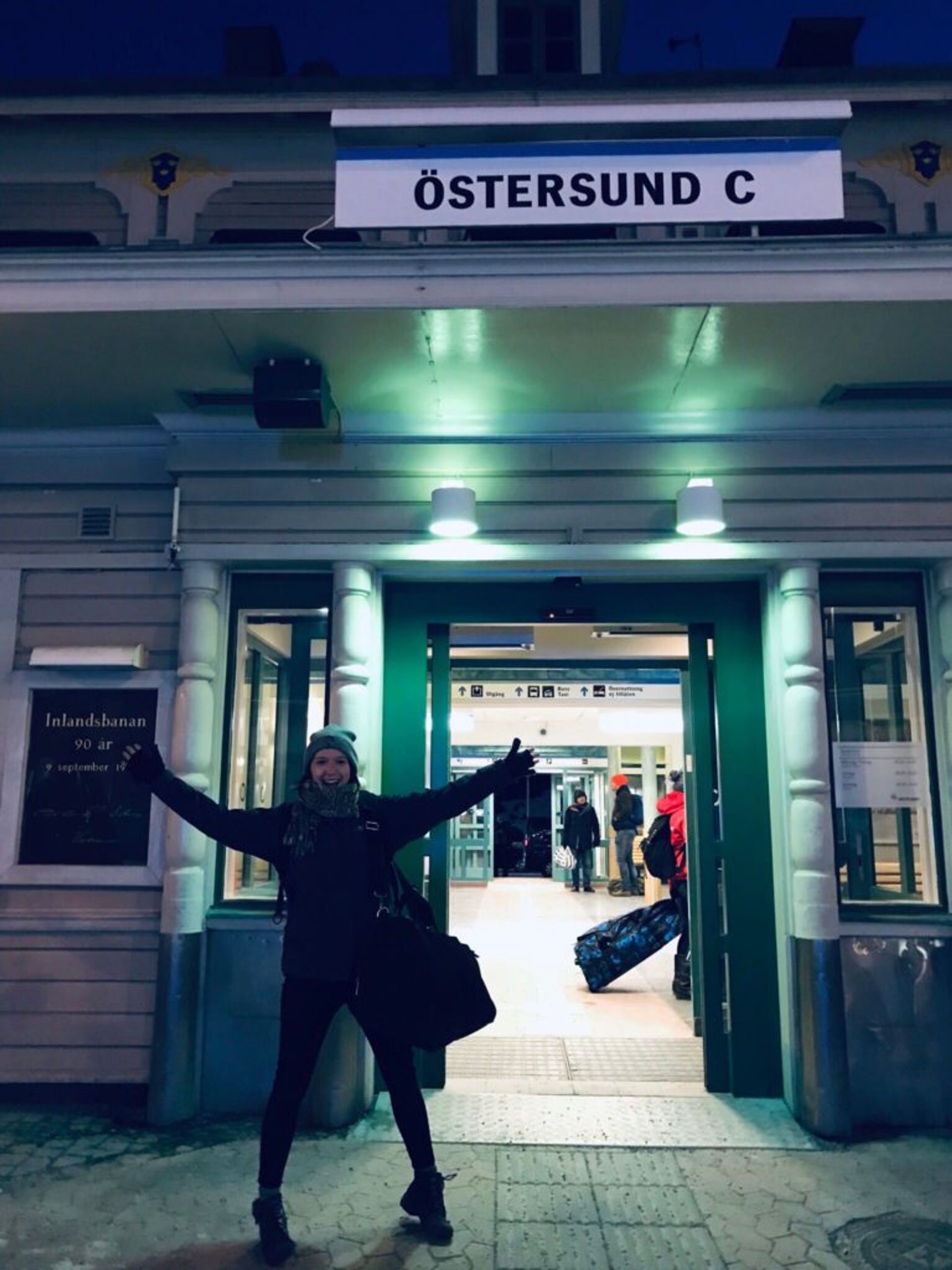 A smiling woman in front of the train station in Östersund in Swe