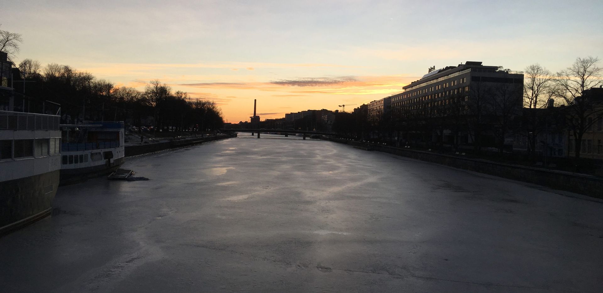 Sunset over the frozen river in Turku.