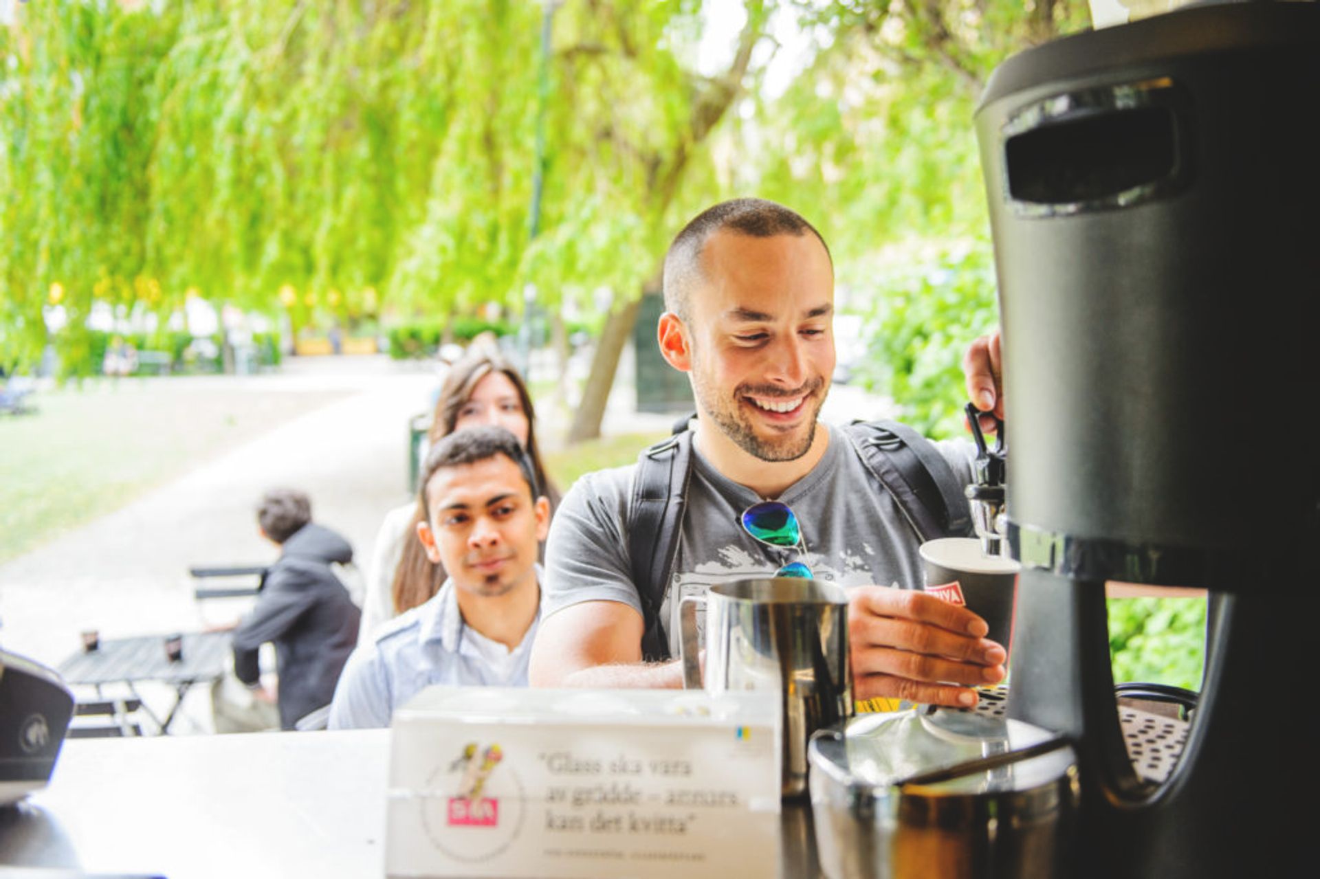 Friends taking a coffe outside.