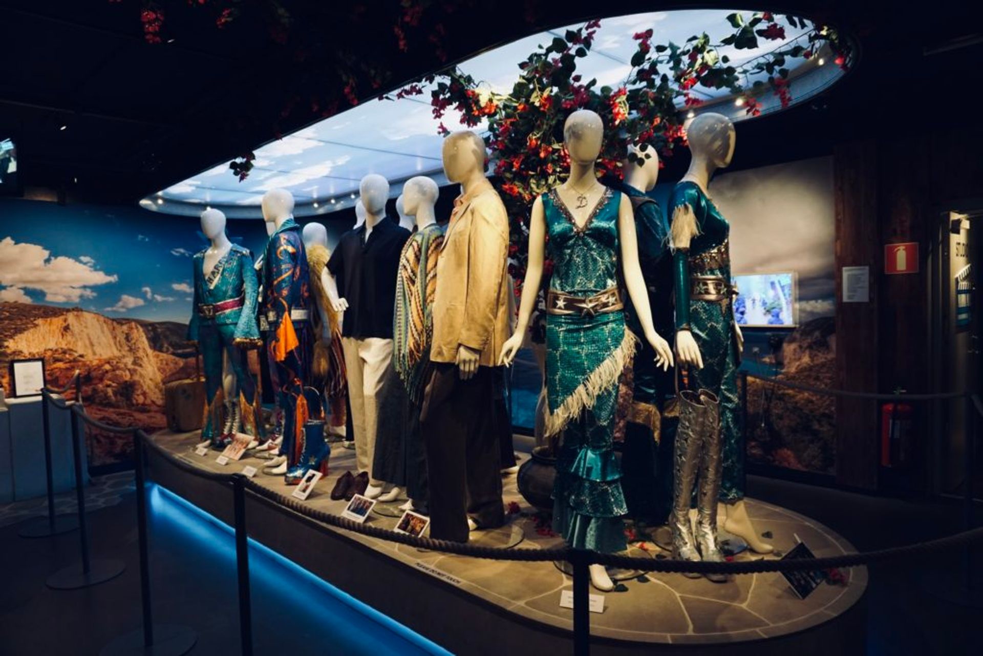 Mamma Mia costumes in an exhibition.