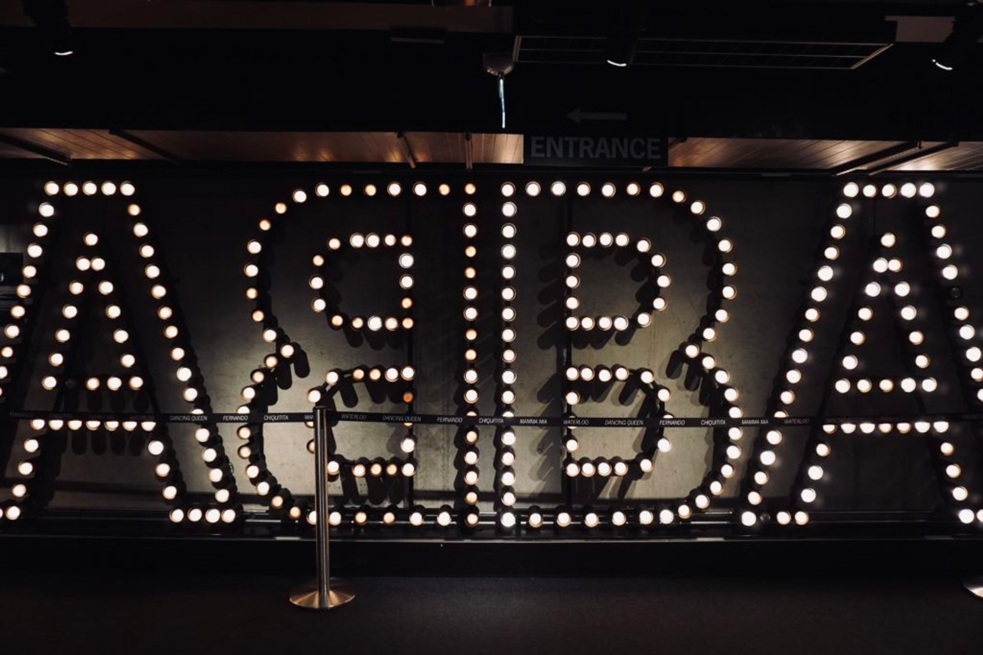 Lightbulbs on a wall spelling 'ABBA'