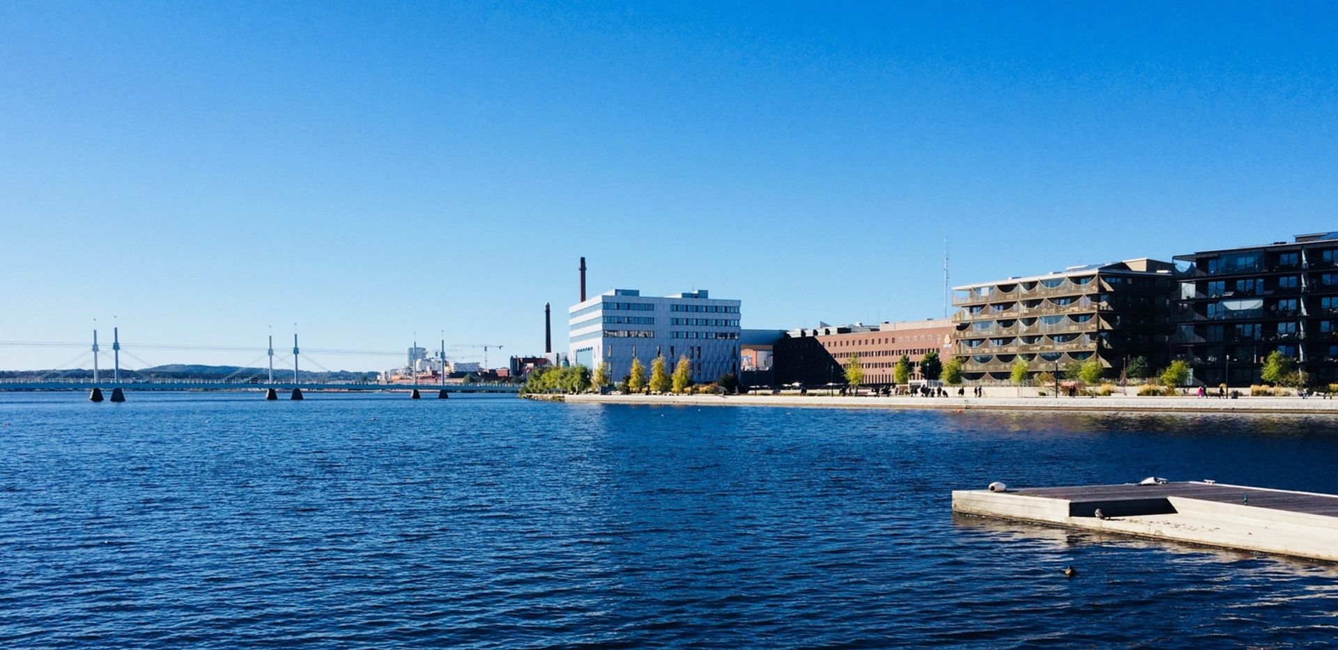 Buildings beside a lake.