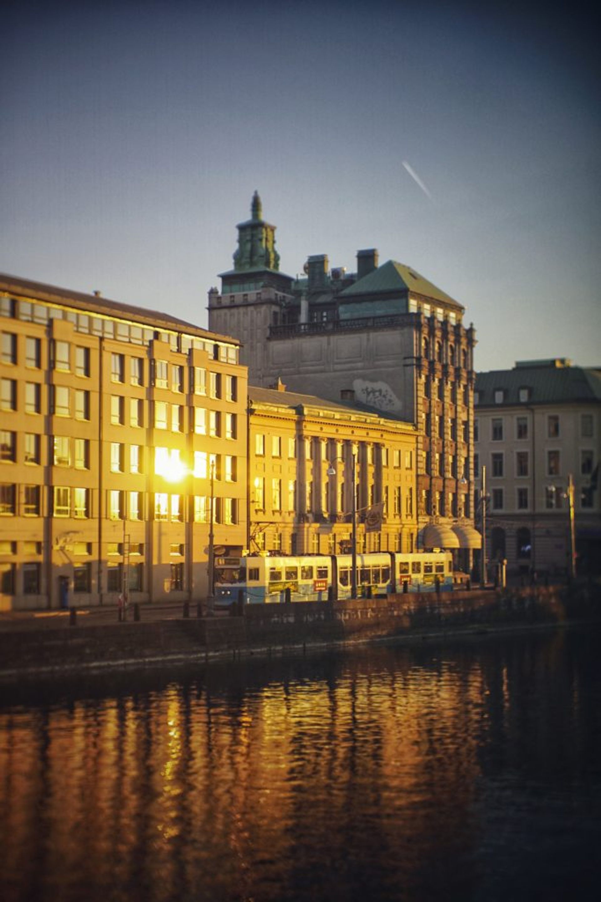 A tram passes by a building in Gothenburg.