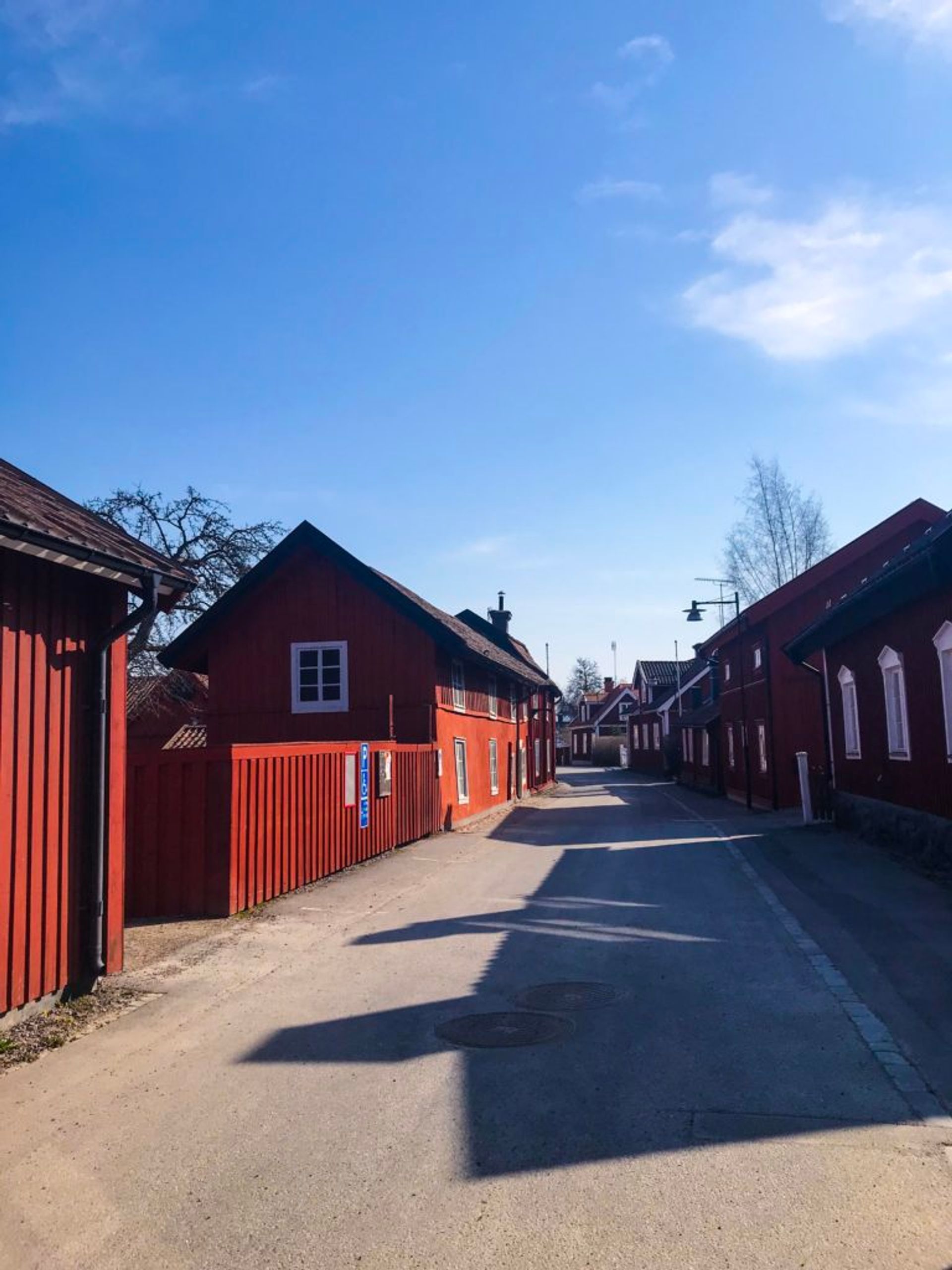 Wooden buildings painted in a dark red colour.