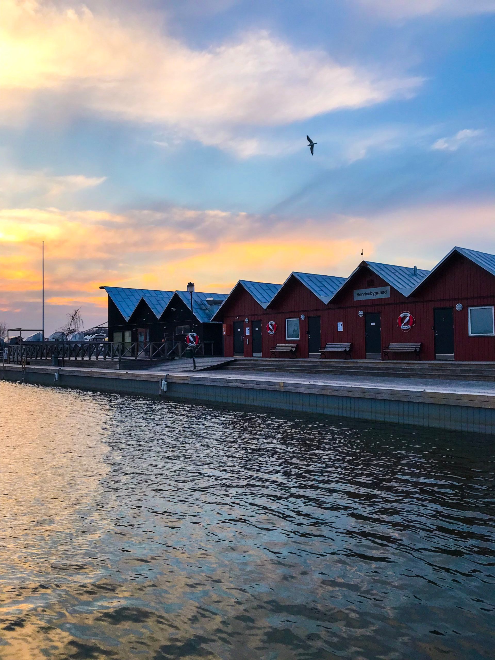 Small wooden cabins beside the sea.