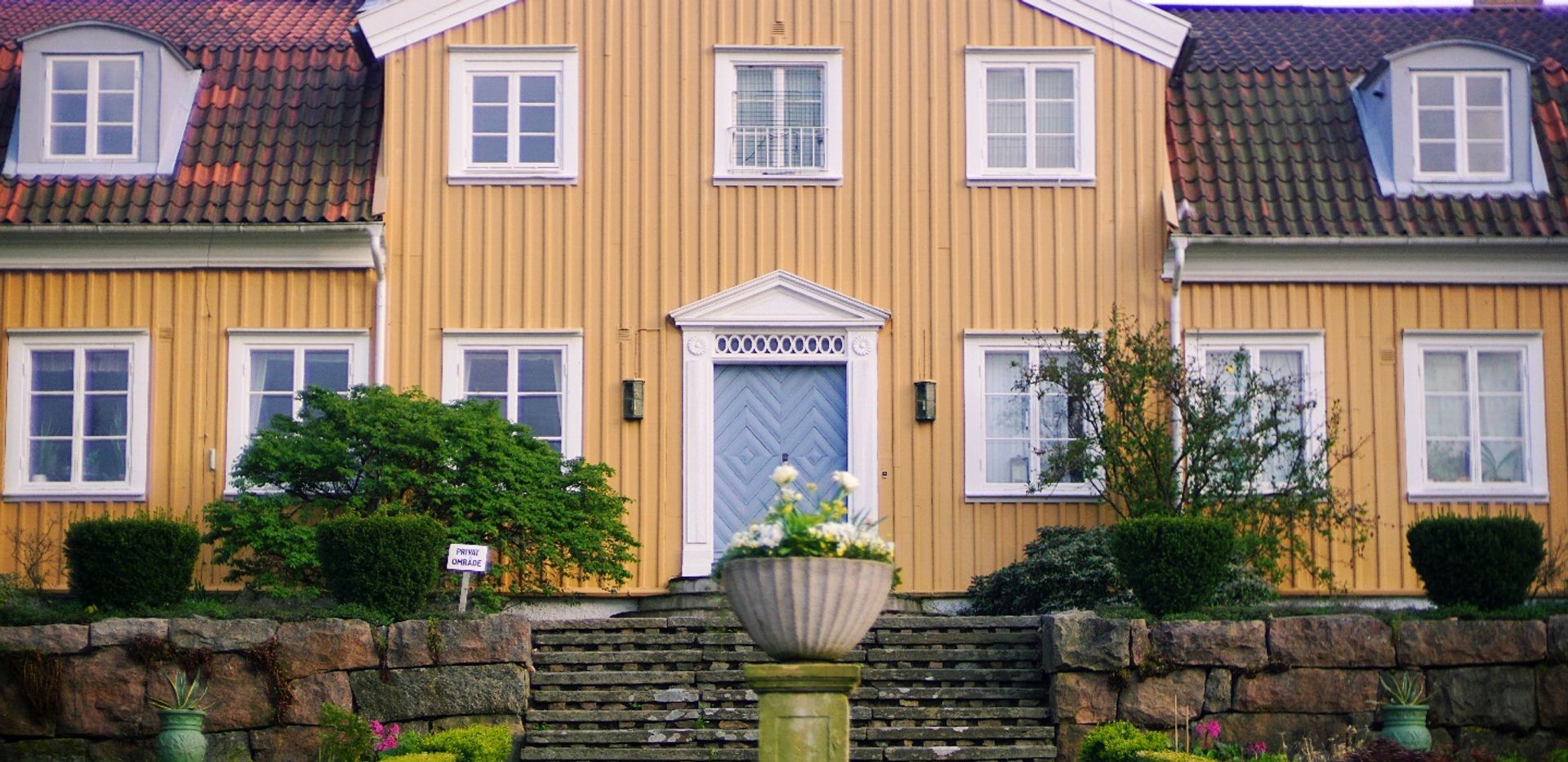 An old, yellow-painted wooden building.