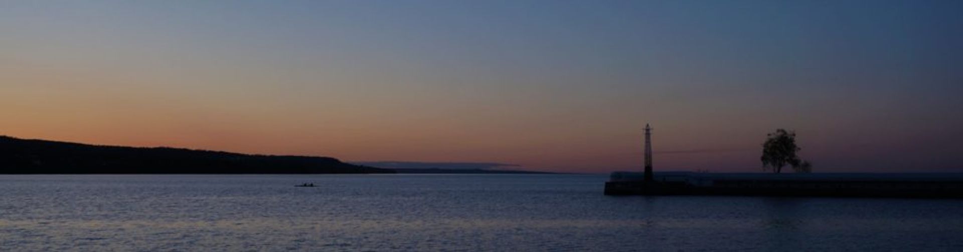 Wide shot of a lake during a sunset.