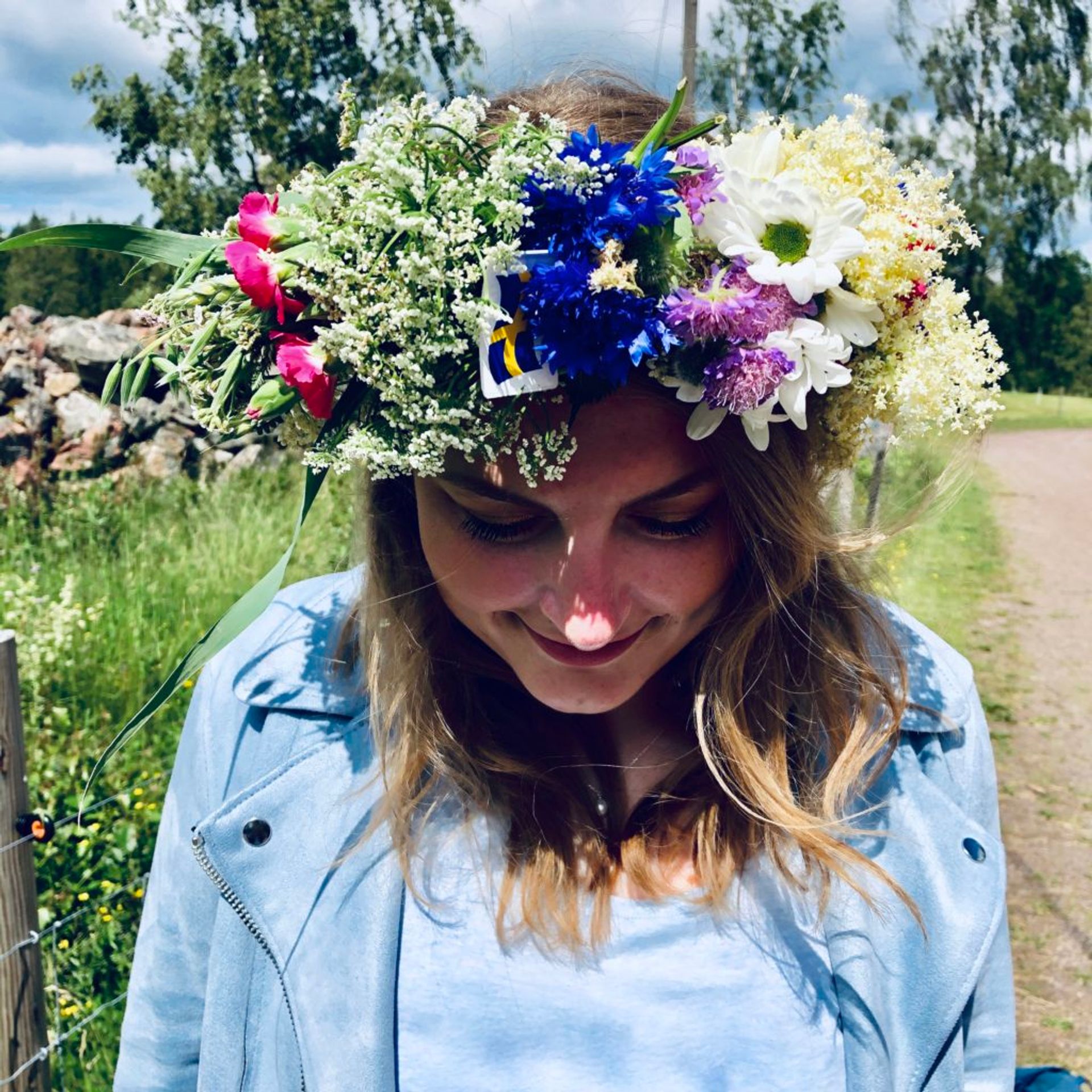 Close-up of a crown made of freshly picked flowers.