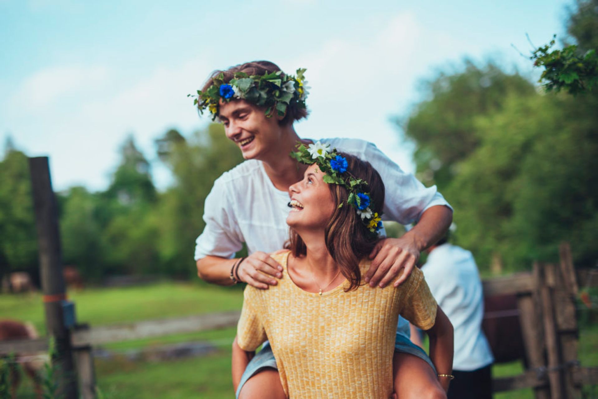 Two students wearing flower crowns.
