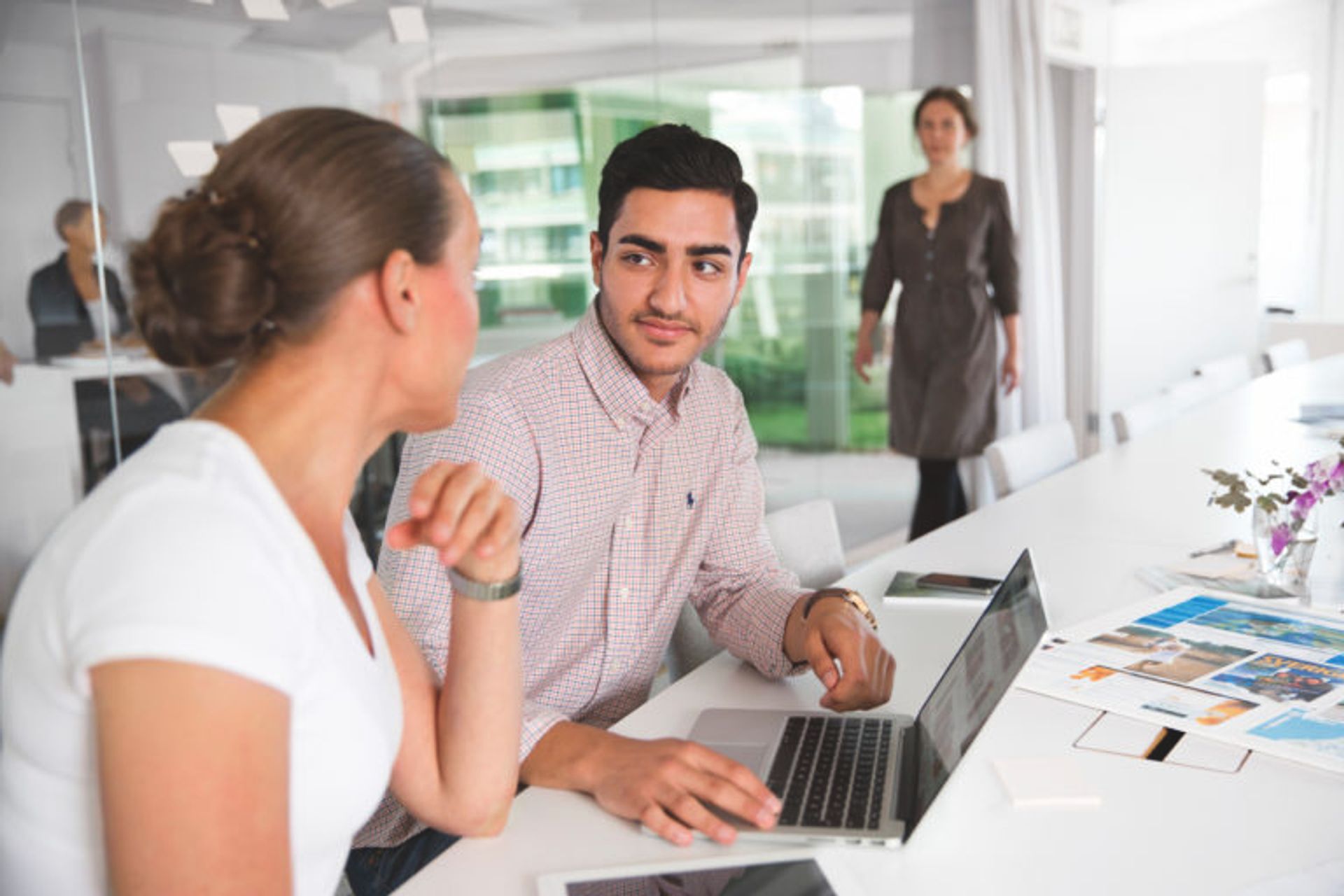 Two people working in an office.