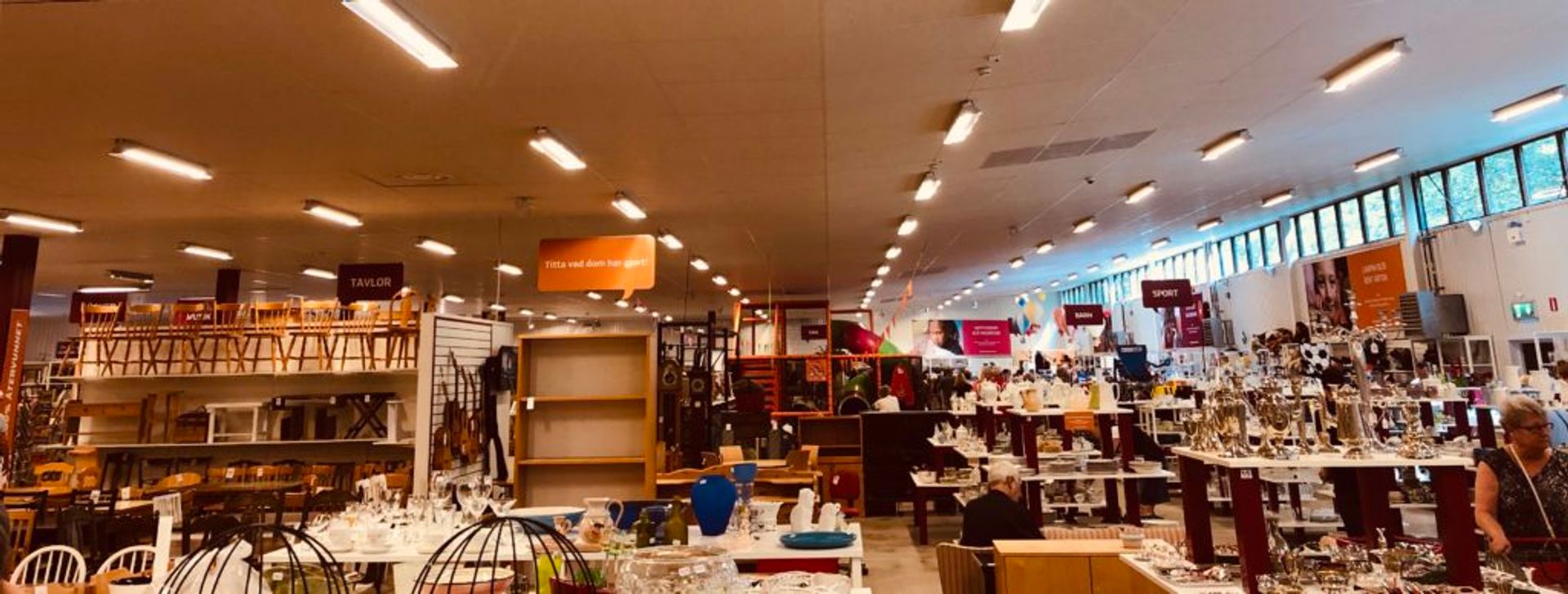 Shelves of items in a second-hand shop.