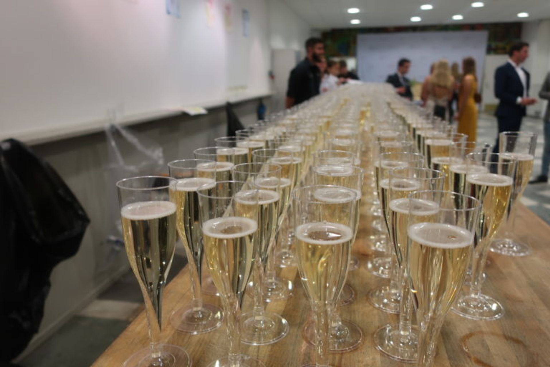 Close-up of hundreds of glasses of champange.