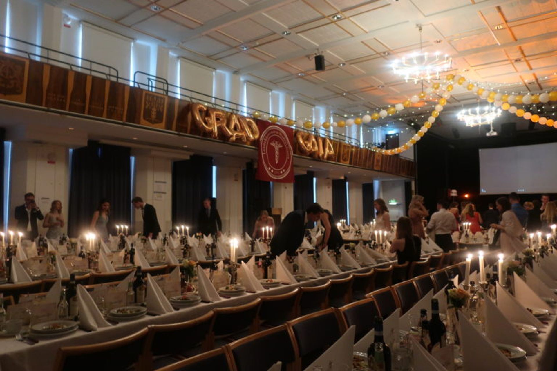 Long dining tables set up for a banquet.