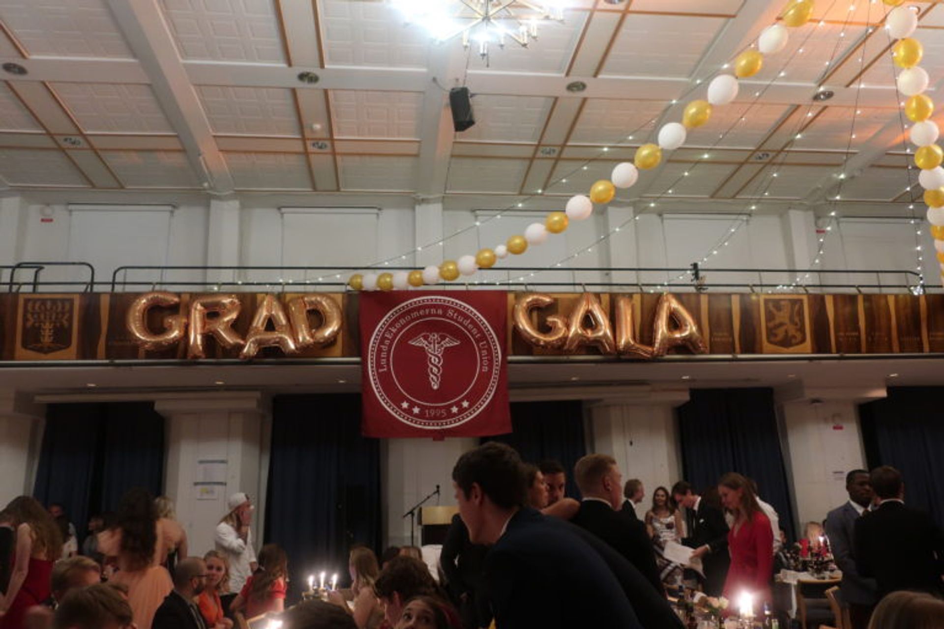 A large hall full of graduating students.