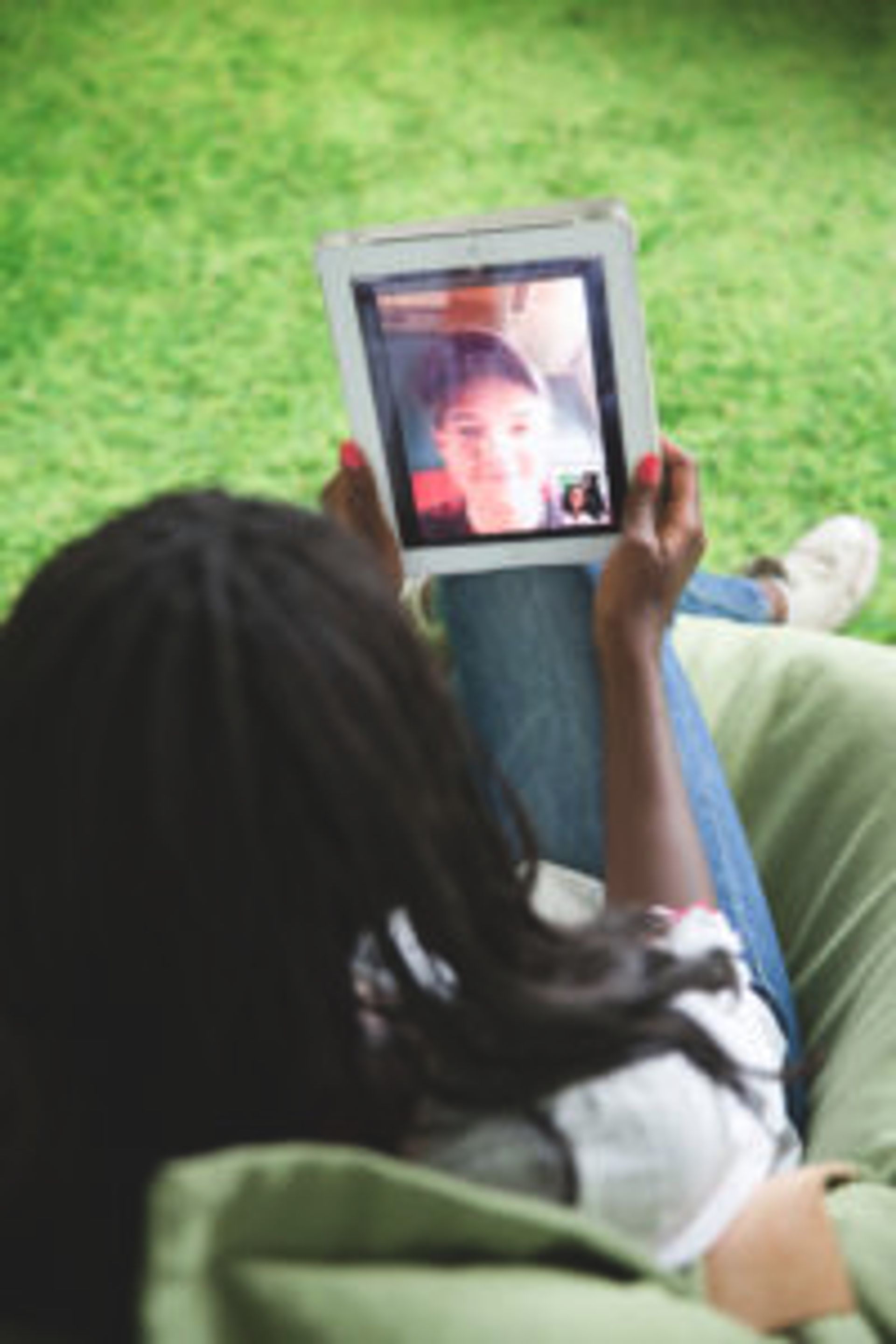 Person having a video call on an iPad.