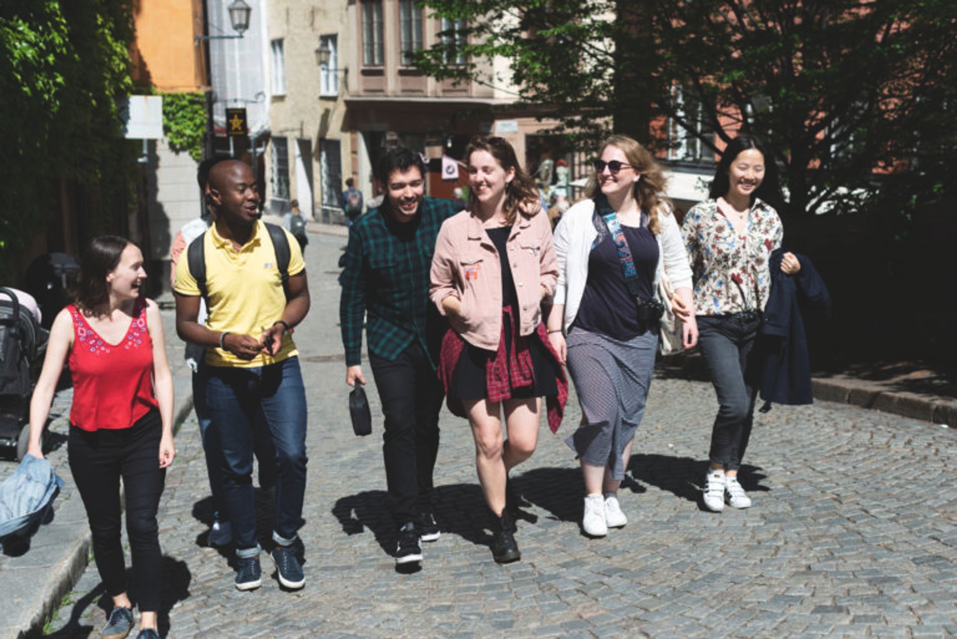 A group of students walking in Stockholm's Old Town.