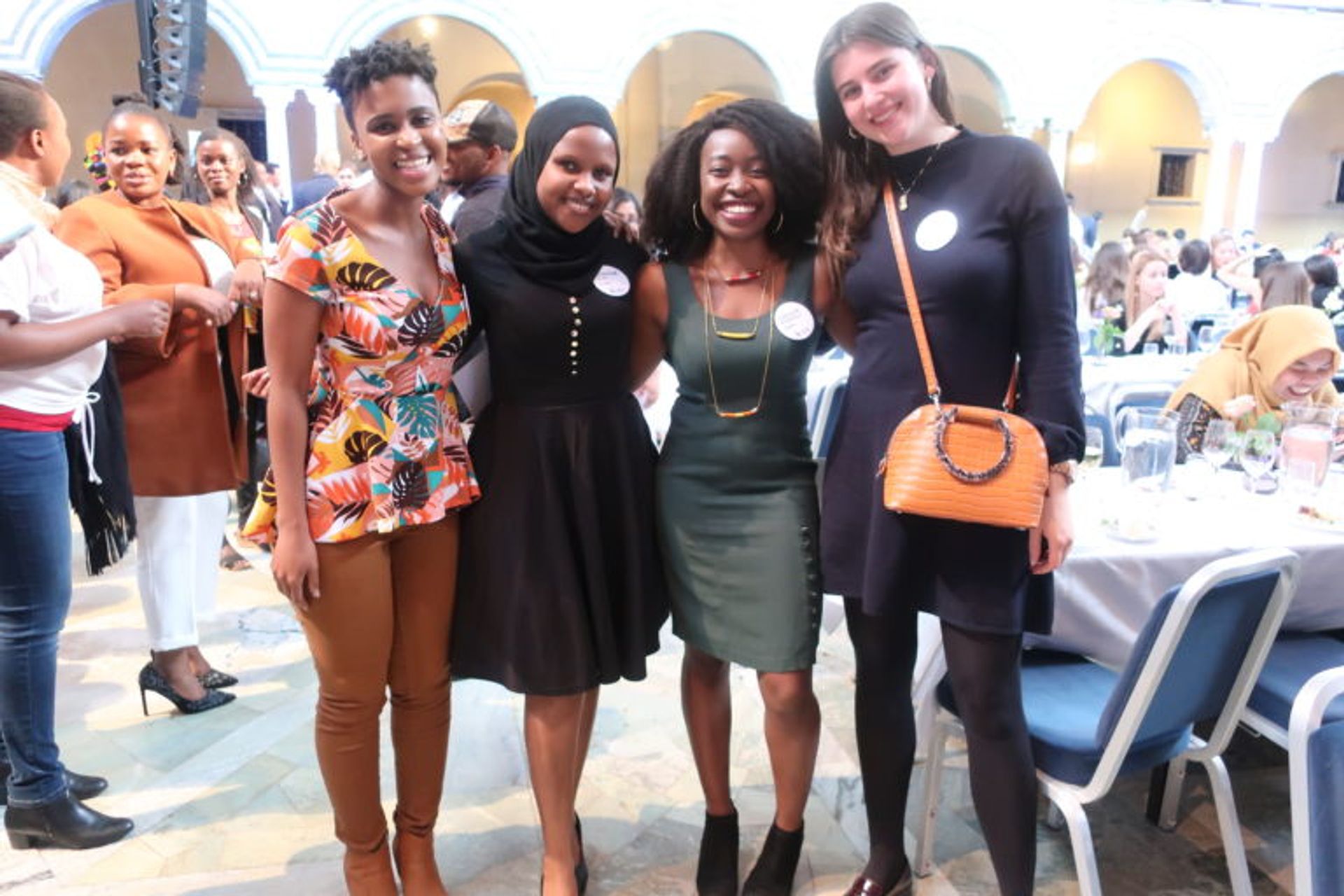 Four students posing together for a photo.