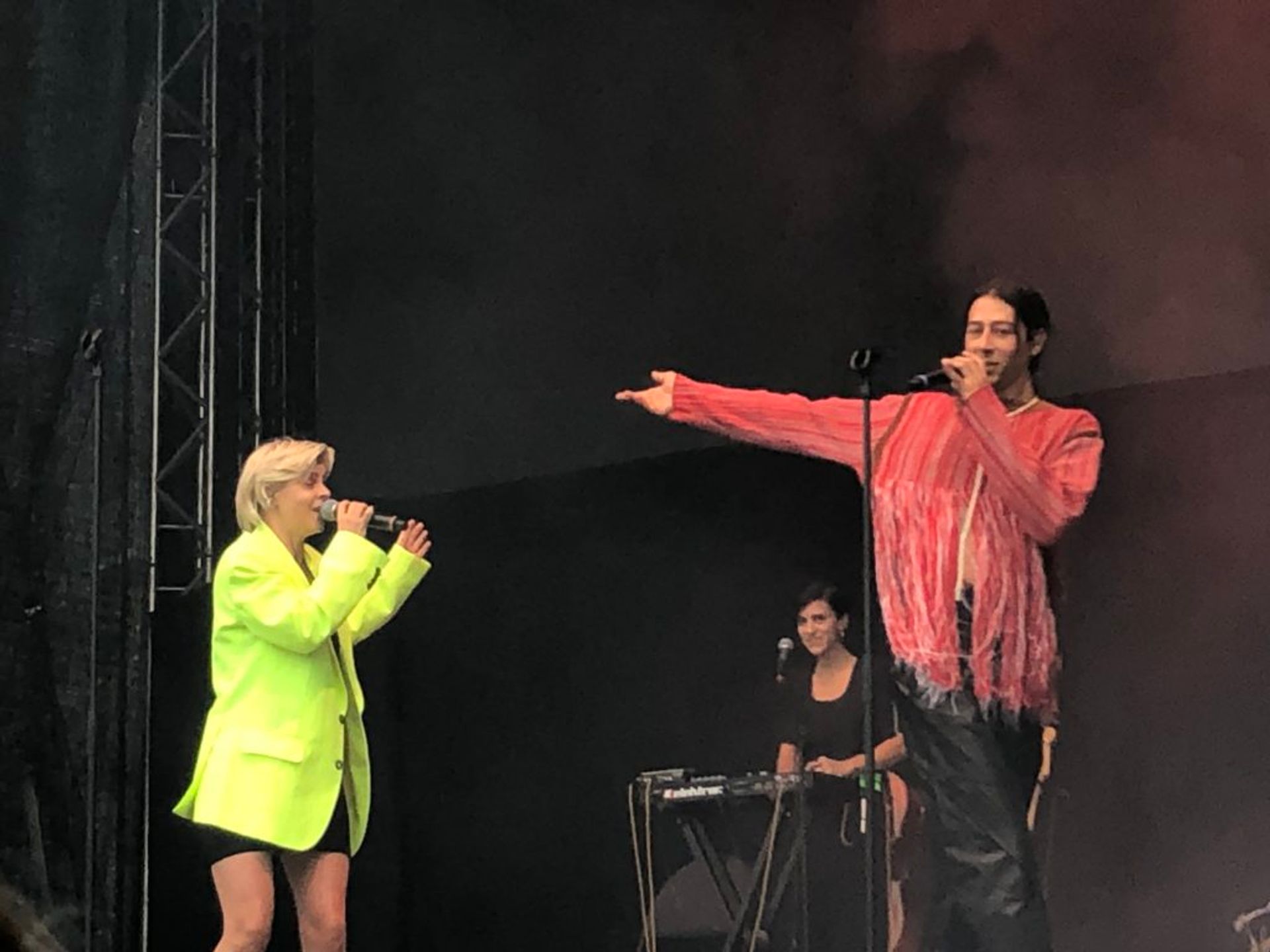 Kindness and Robyn singing together on stage.