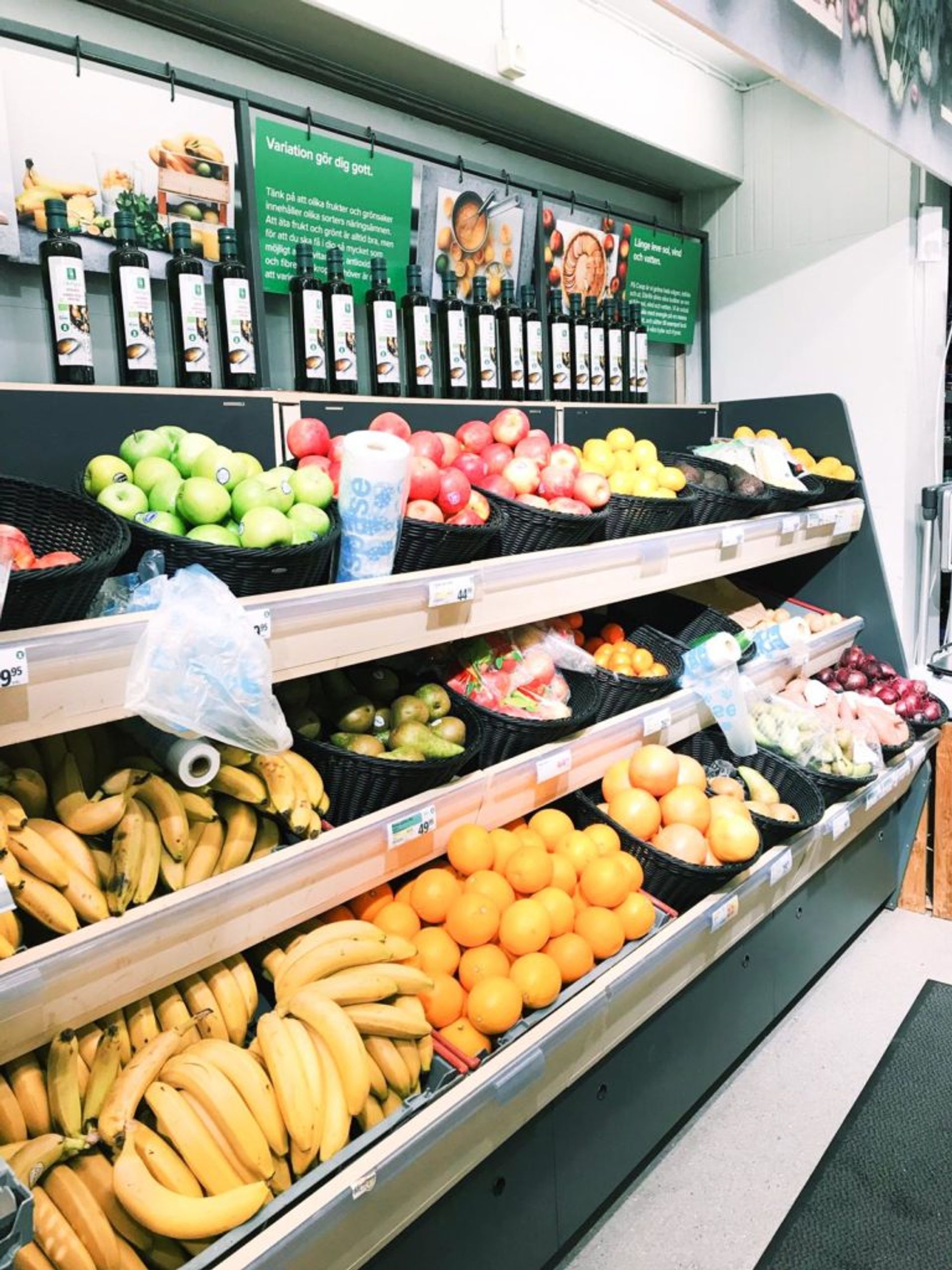 Shelves of fresh fruit in a grocery store.